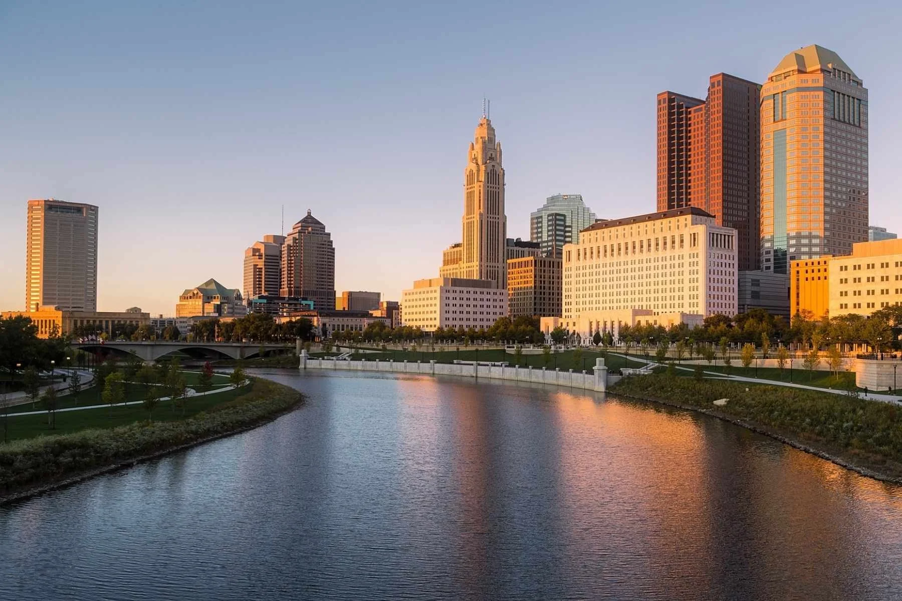 Scenic view of the Columbus, Ohio city skyline along the riverfront, an ideal destination to explore using convenient local camper van rentals.