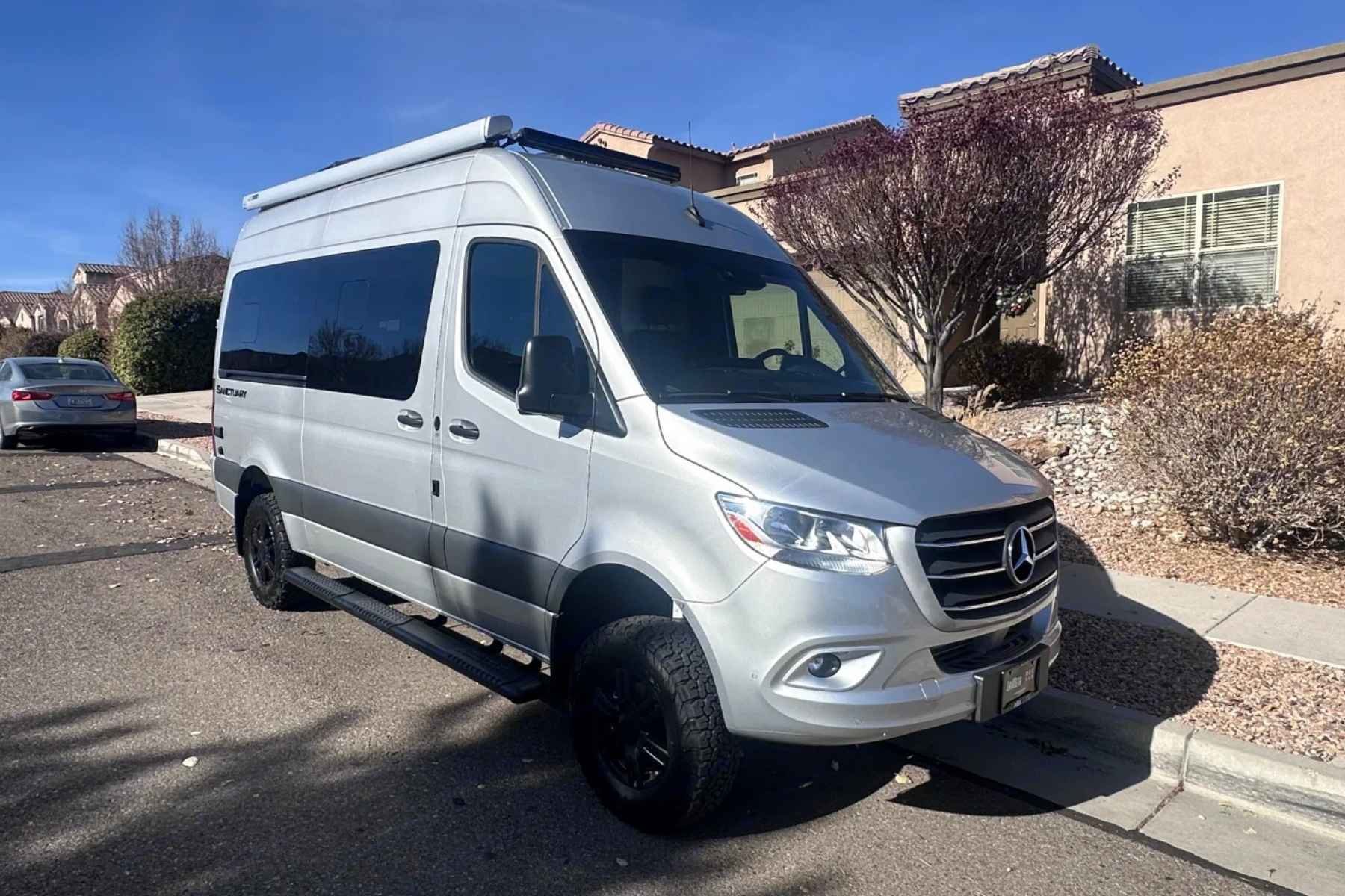 Mercedes Sprinter Class B RV rental parked on a residential street in New Mexico