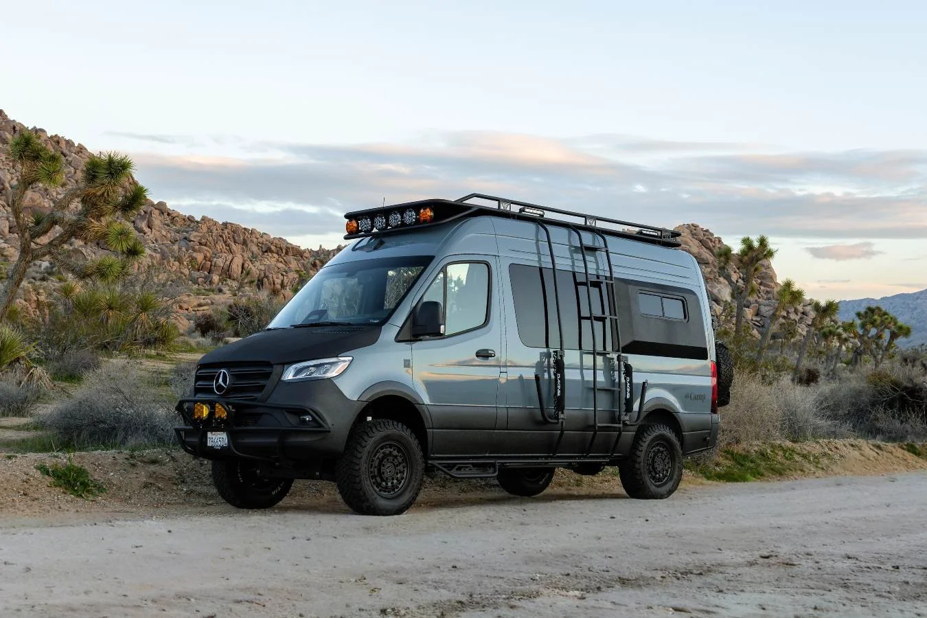 Luxury Mercedes Sprinter camper van parked near Joshua Tree State Park, California.