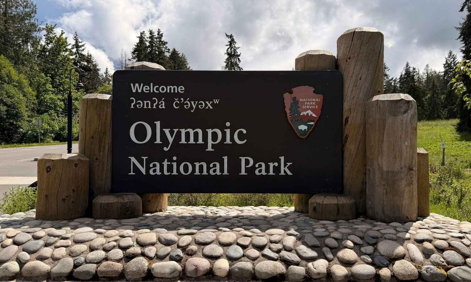 Olympic National Park entrance sign, a popular destination for camper van rentals departing from Seattle.