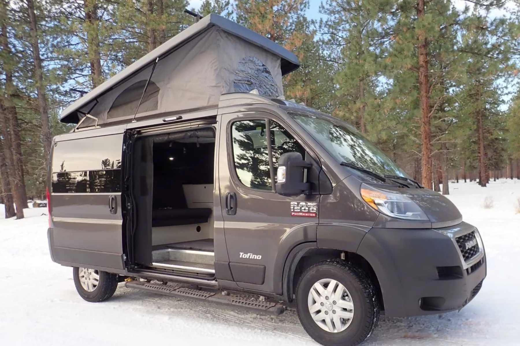 Pleasure-Way Tofino pop-top camper van rental in Bend, Oregon with raised roof and winter-ready setup