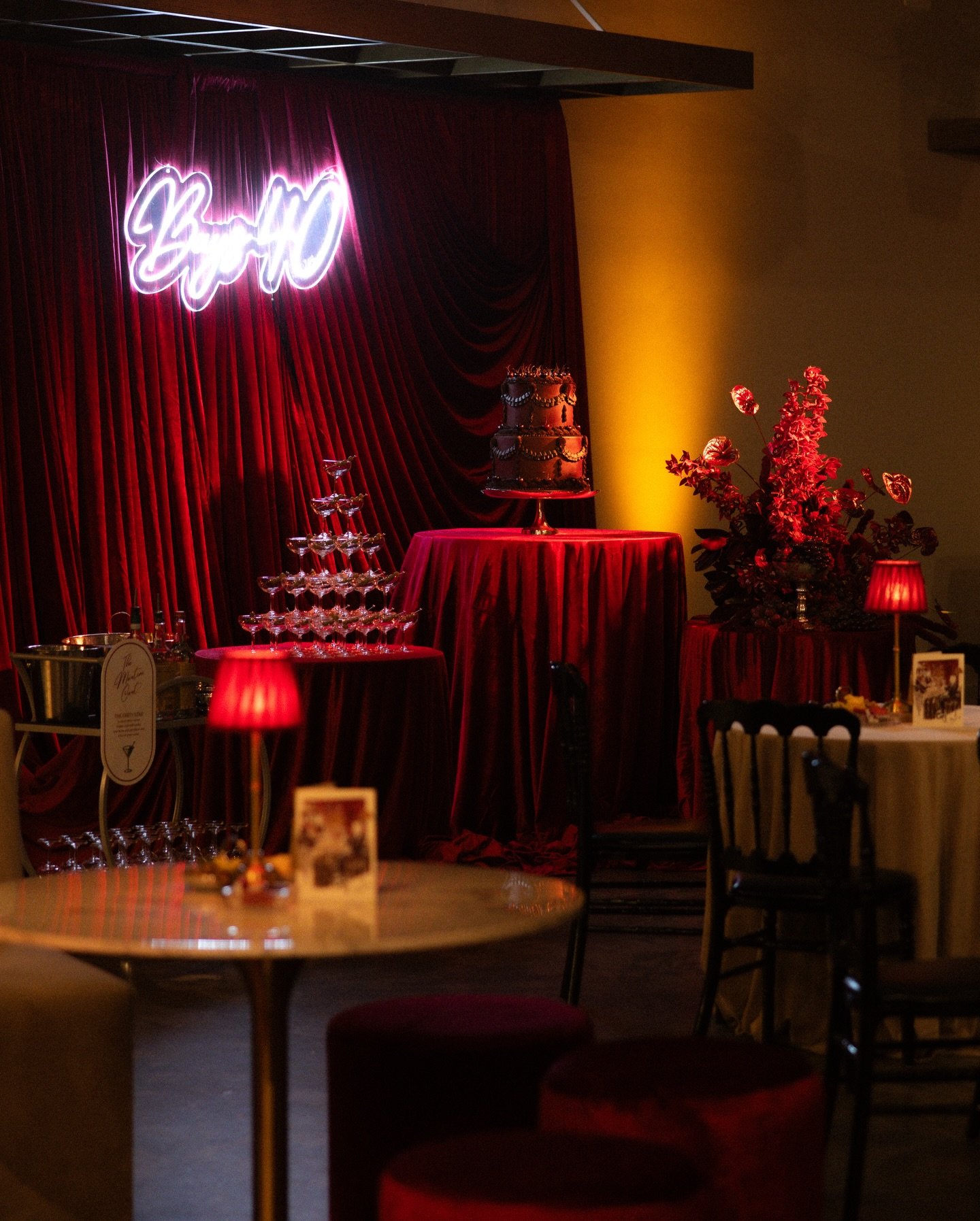 A bespoke cabaret lounge designed for a 40th birthday celebration. Rich burgundy hues, deep red tones, and layered textures created a sultry, luxurious atmosphere. Elevated with custom details and a statement martini tower to complete the experience 