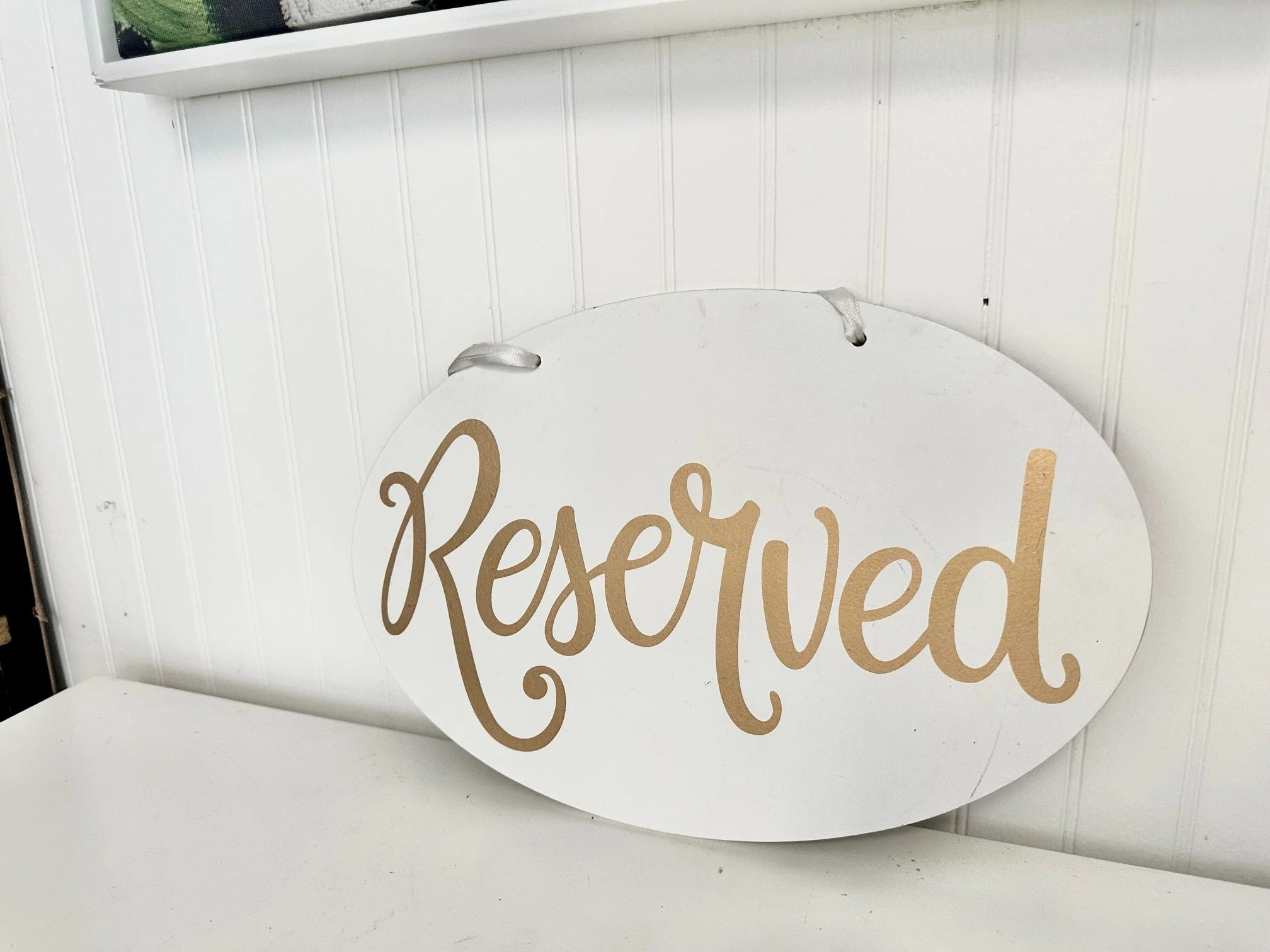 White wood with gold lettering reserved sign.jpeg