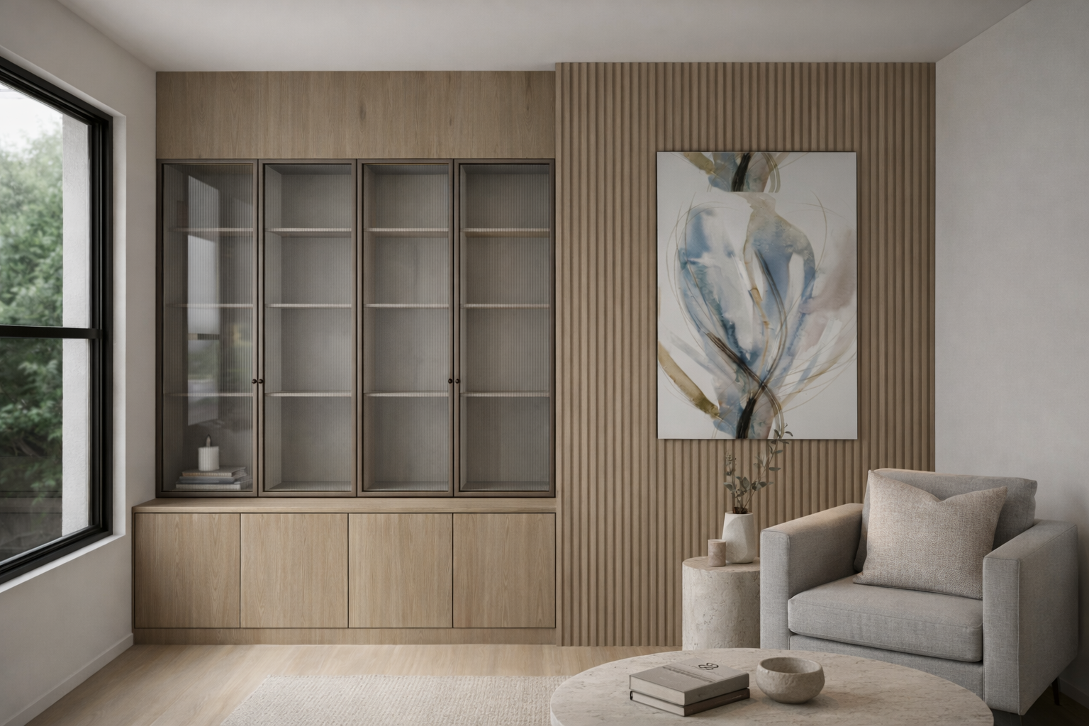 A minimalist living room corner with a large window, a wooden display cabinet with glass doors, an abstract art piece on a wooden slat wall, a beige armchair with a matching pillow, a small side table with a potted plant, and a round coffee table wit