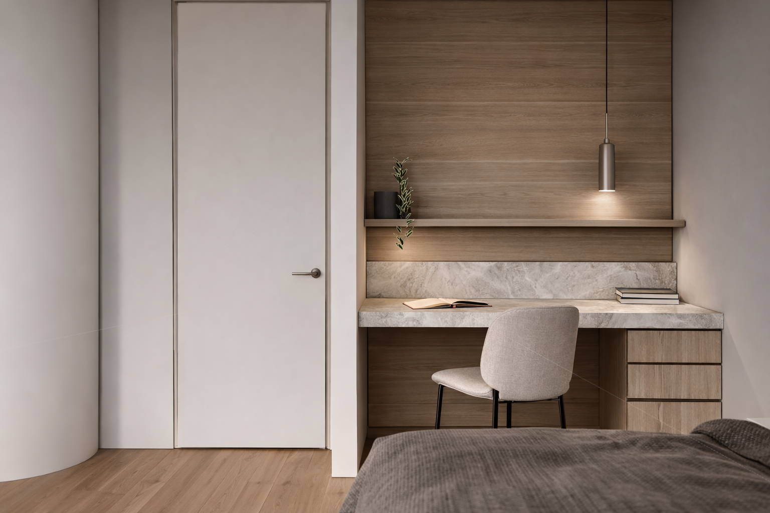 A minimalist bedroom corner with a built-in desk and chair. The desk has a marble surface with a book and several stacked books. Above the desk, there is a wooden shelf with a small plant and a black decorative object. A pendant light hangs above the
