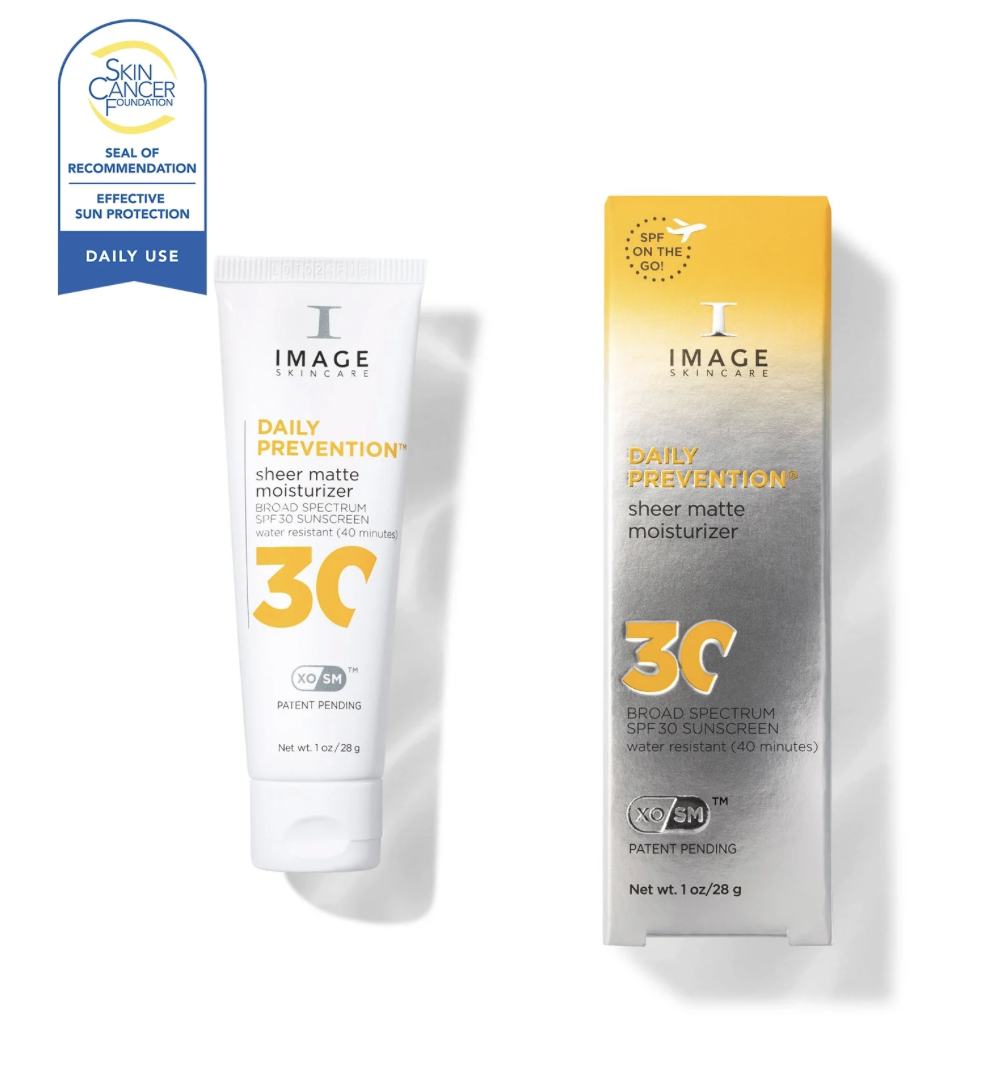 The image features a tube and box of Image Skincare Daily Prevention sheer matte moisturizer with SPF 30. The packaging is predominantly white and silver with orange lettering. The bottle is positioned to the left of the box, which is upright. A blue