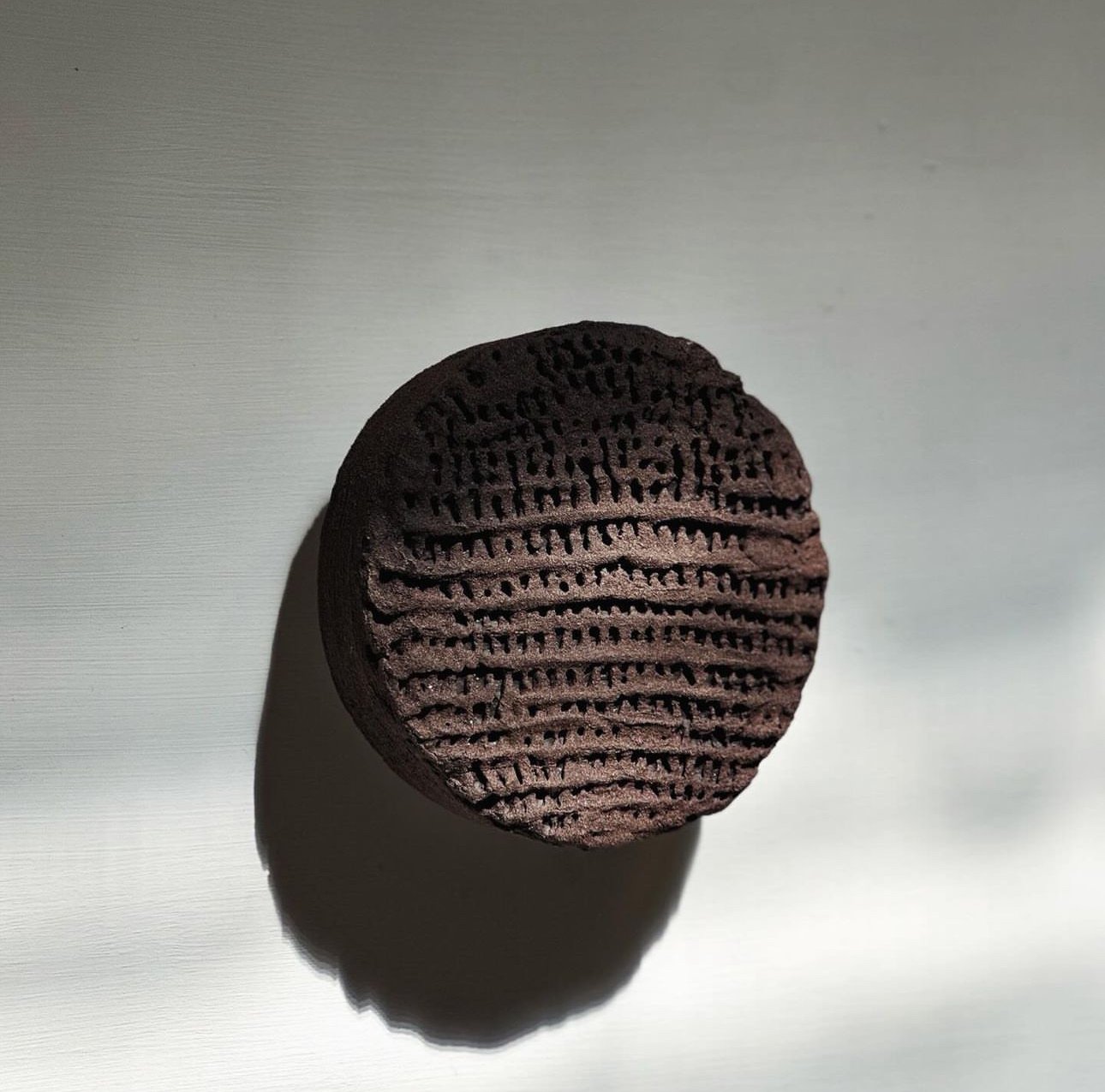 Igne Sconce Ember | Unique Tasmanian wall sconce showcasing sustainable design and natural materials.