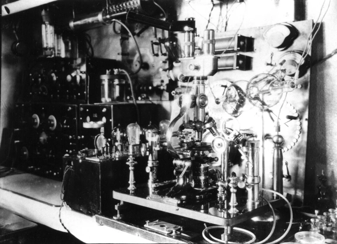 #3 ray device on workbench, with #2 microscope and Piffard tube. Dated 1932 or later. Kennedy radio at left, on back corner of bench.