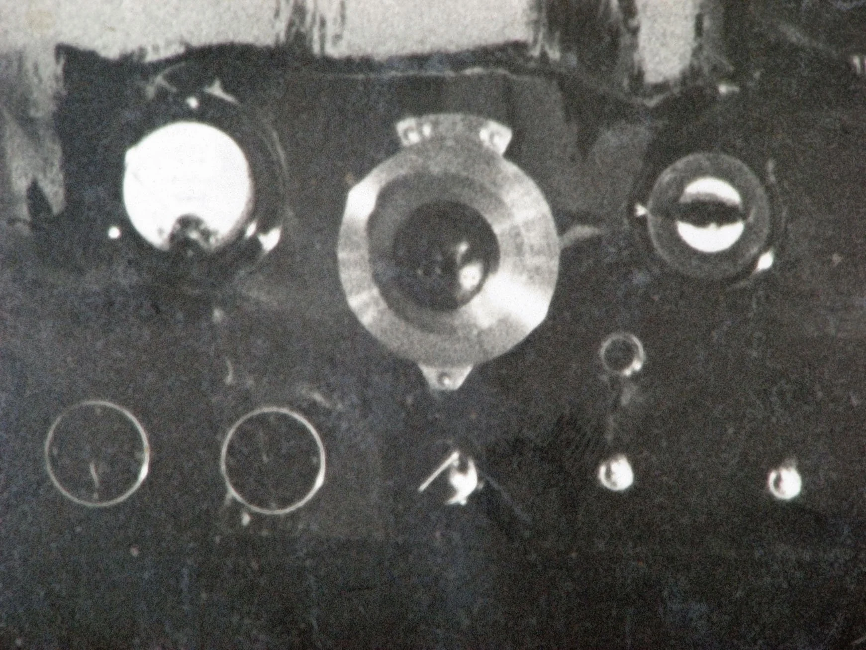 Closeup of the console. Top row, from left to right: likely a milliampmeter; National Co. audio frequency adjustment dial (actual frequencies not indicated); and a modulation depth (strength) meter. Bottom row from left: two apparent 4-position range