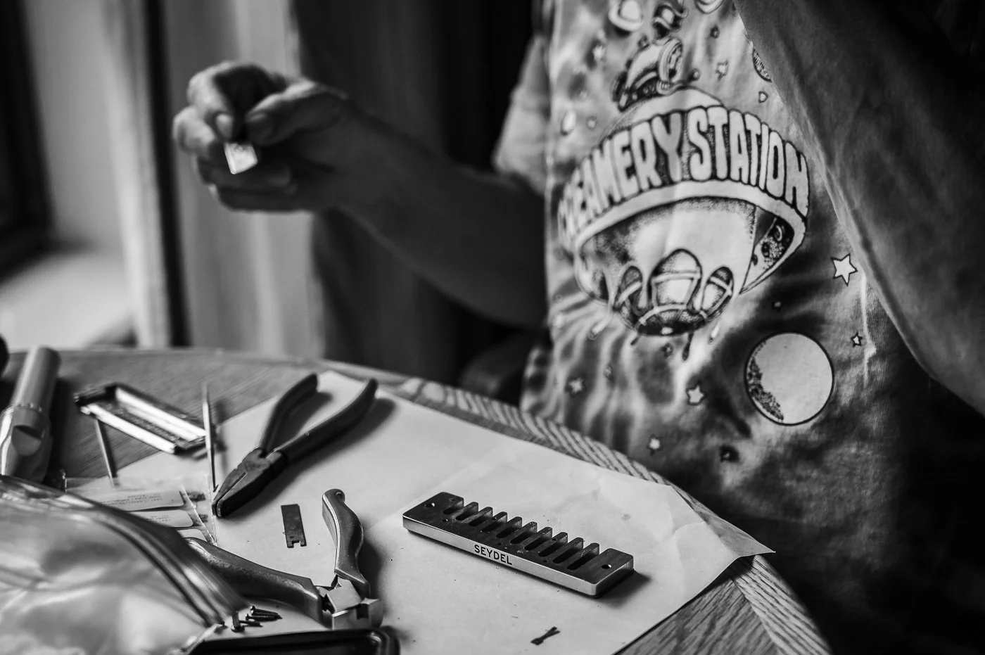 Harmonica Repair on the road in a hotel room during a cross country tour.