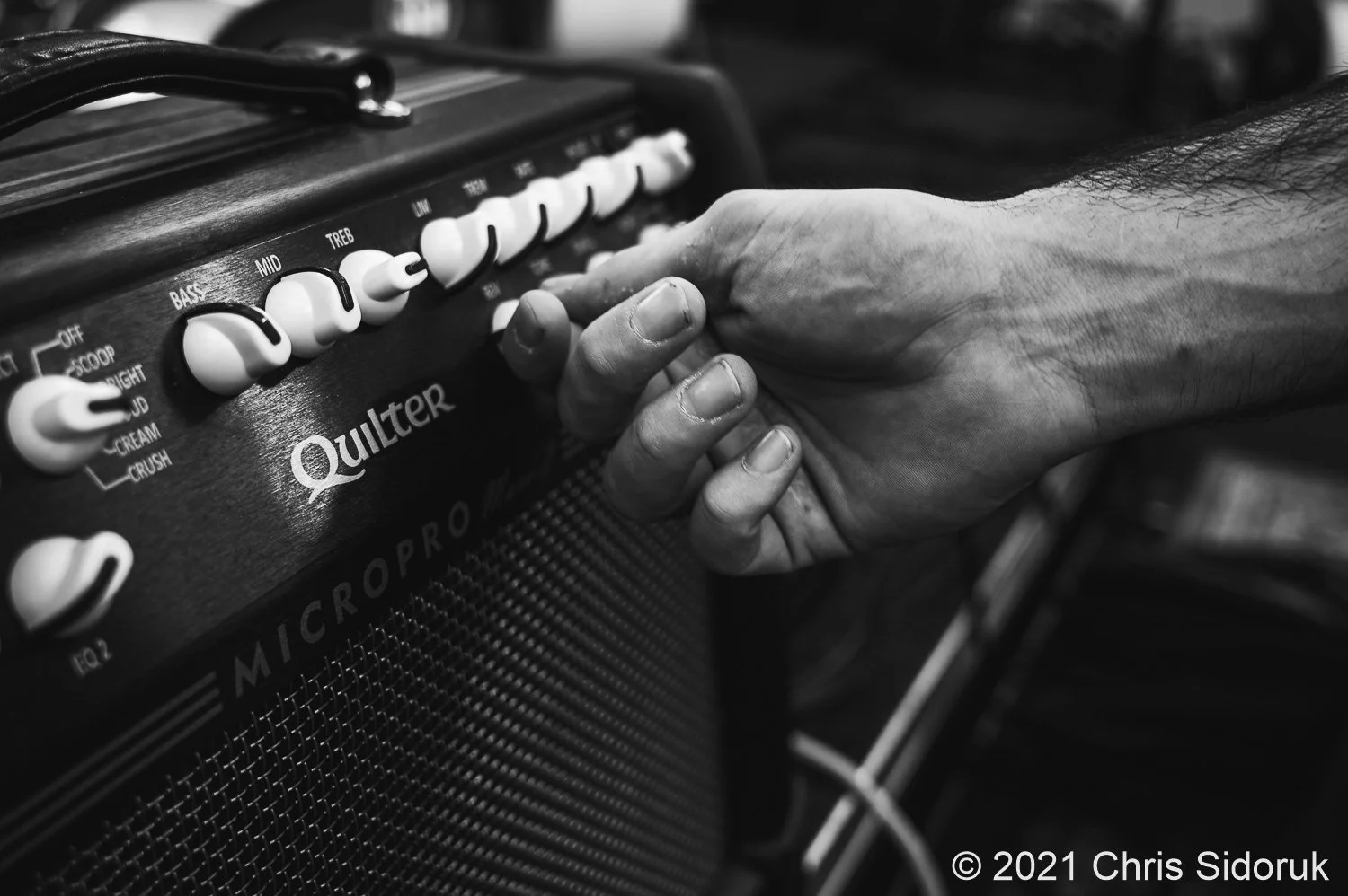 Dylan Kader of Creamery Station, getting the tone just right on his Quilter Amp.