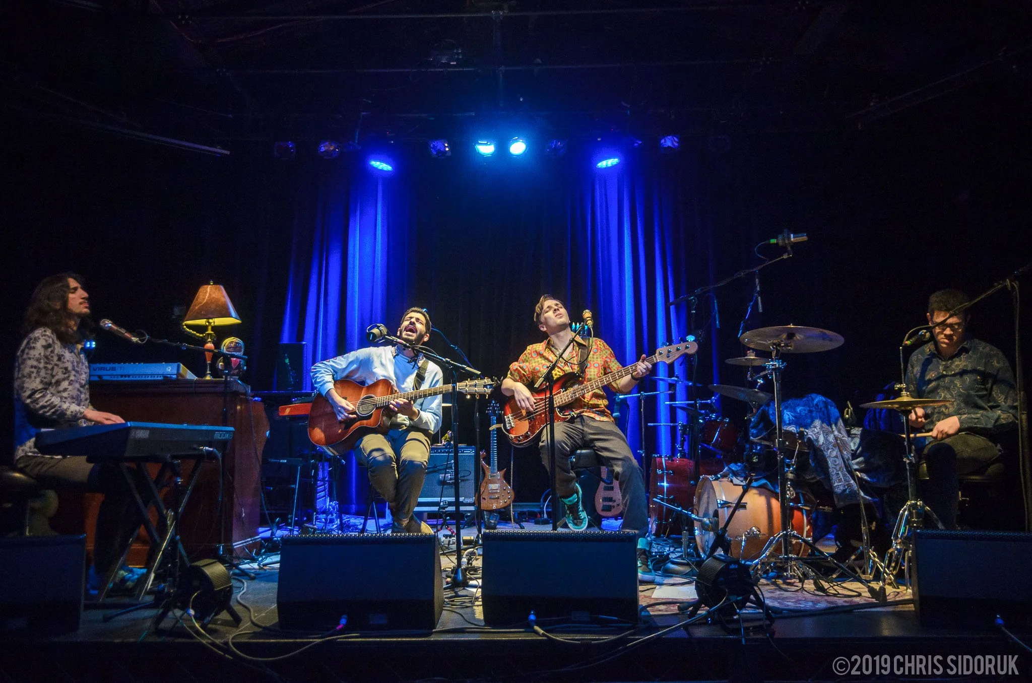 Eggy performing live on stage during a concert performance