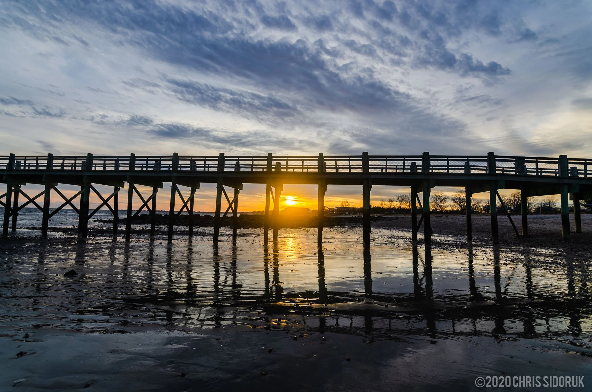  The fishing pier at Walnut Beach in Milford, CT, during sunset. 
