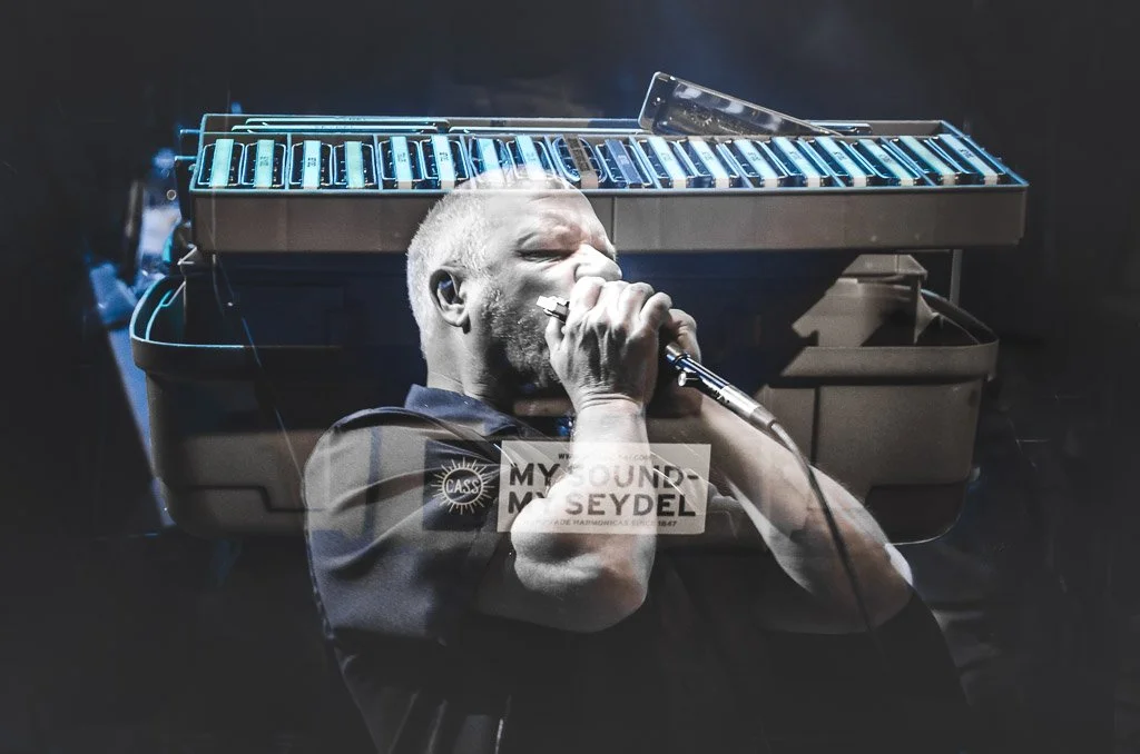 Multiple Exposure Photograph of a Harmonica Player.