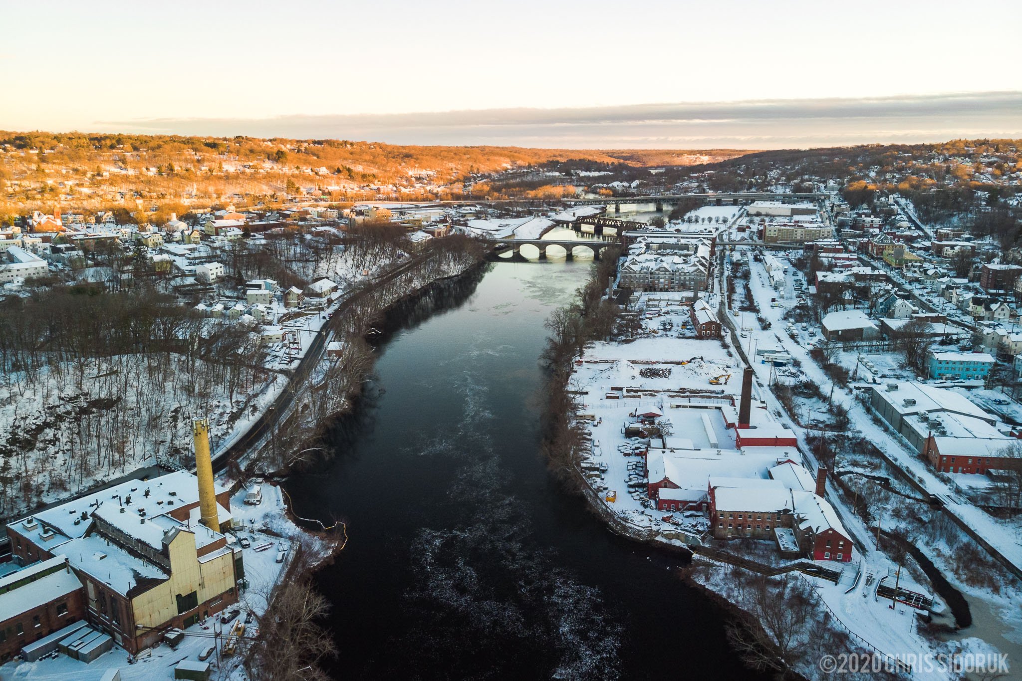 Aerial photograph of the Housatonic River along parts of Shelton and Derby, after snowfall.