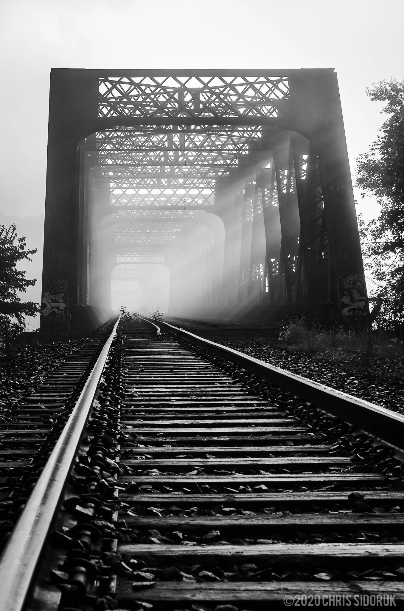 Shelton, CT train trestle bridge during a foggy morning.