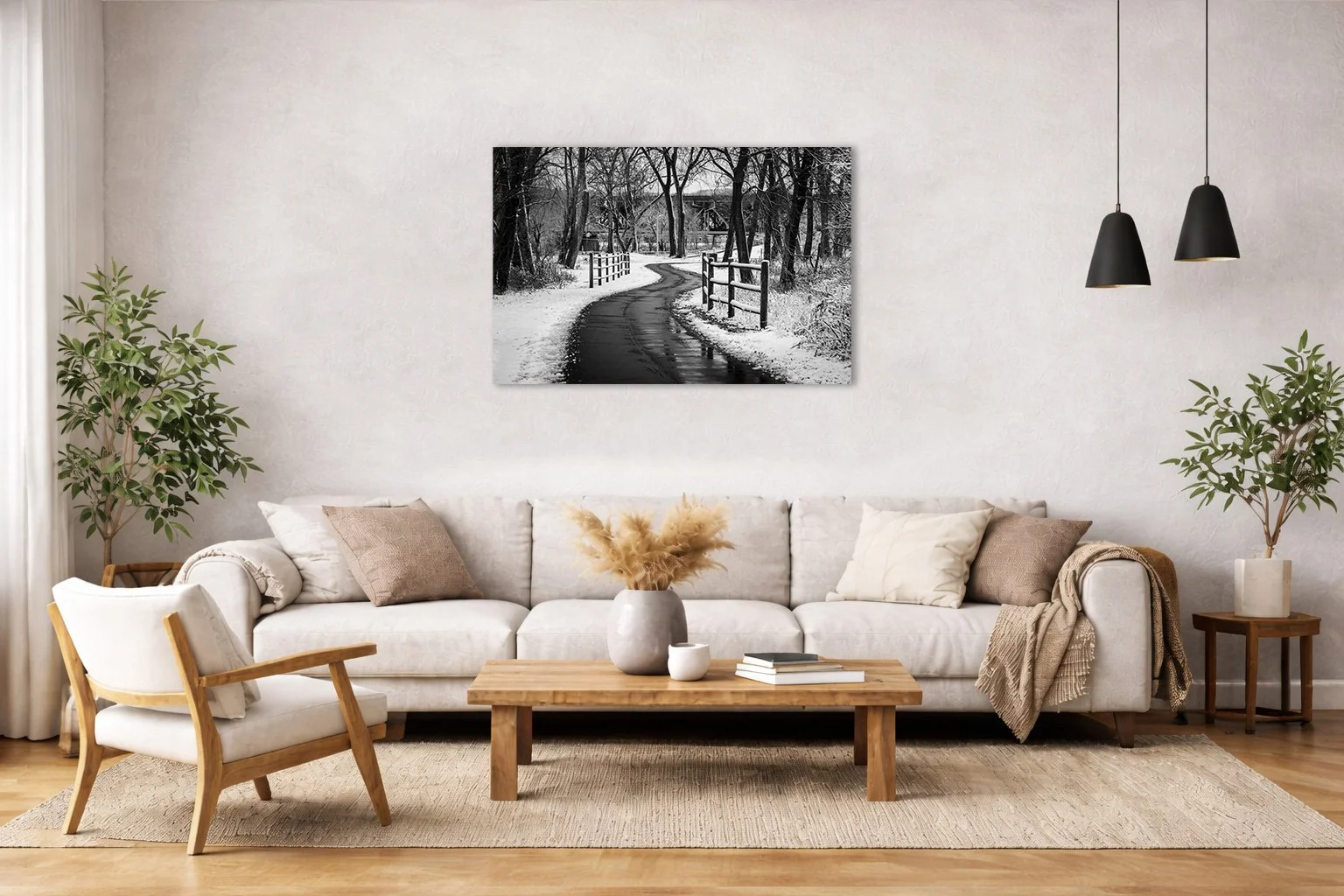 Black and white winter landscape photograph of a winding path displayed in a modern interior