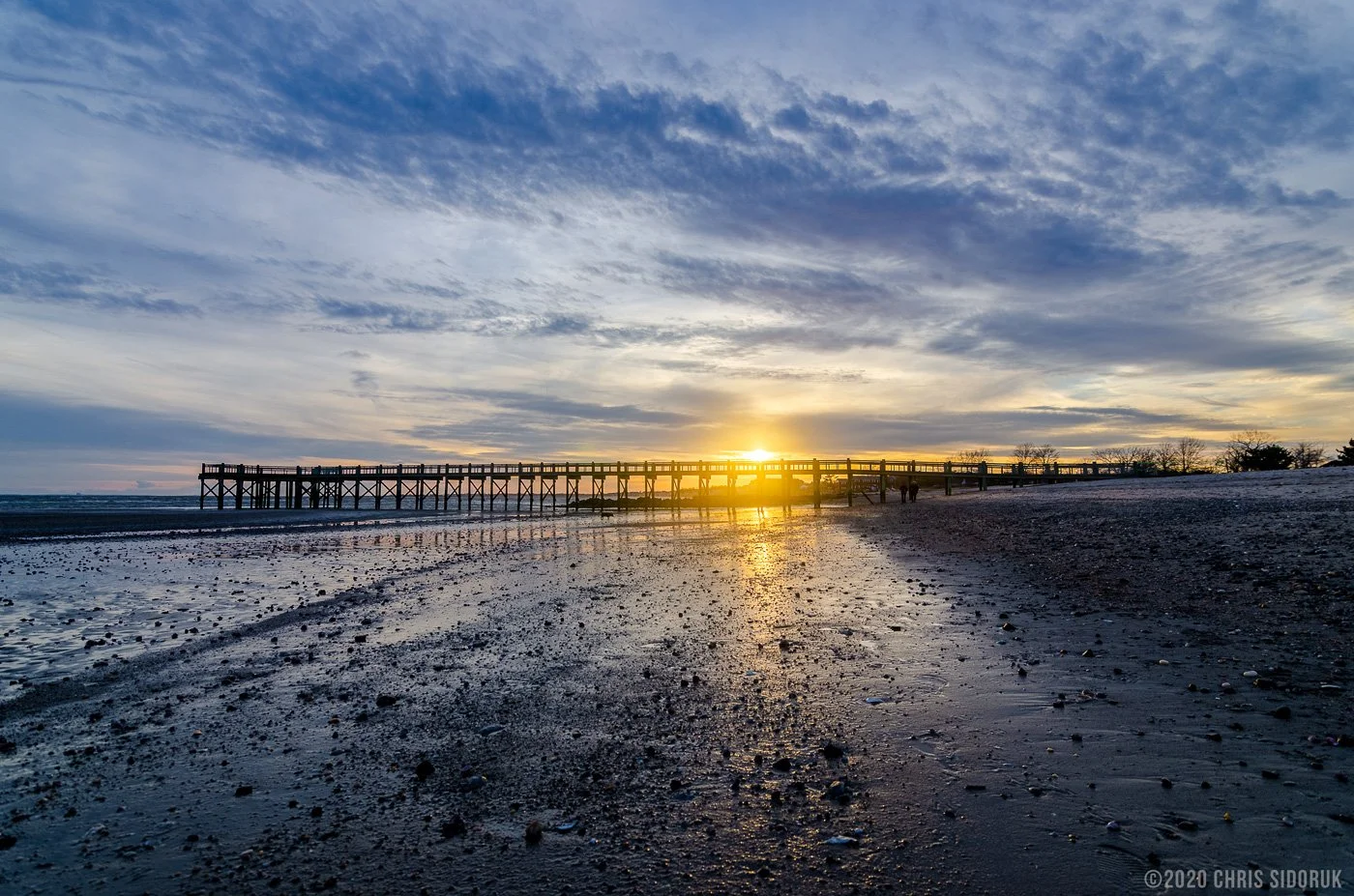 A sunset at the pier of Walnut Beach in Milford, Connecticut.