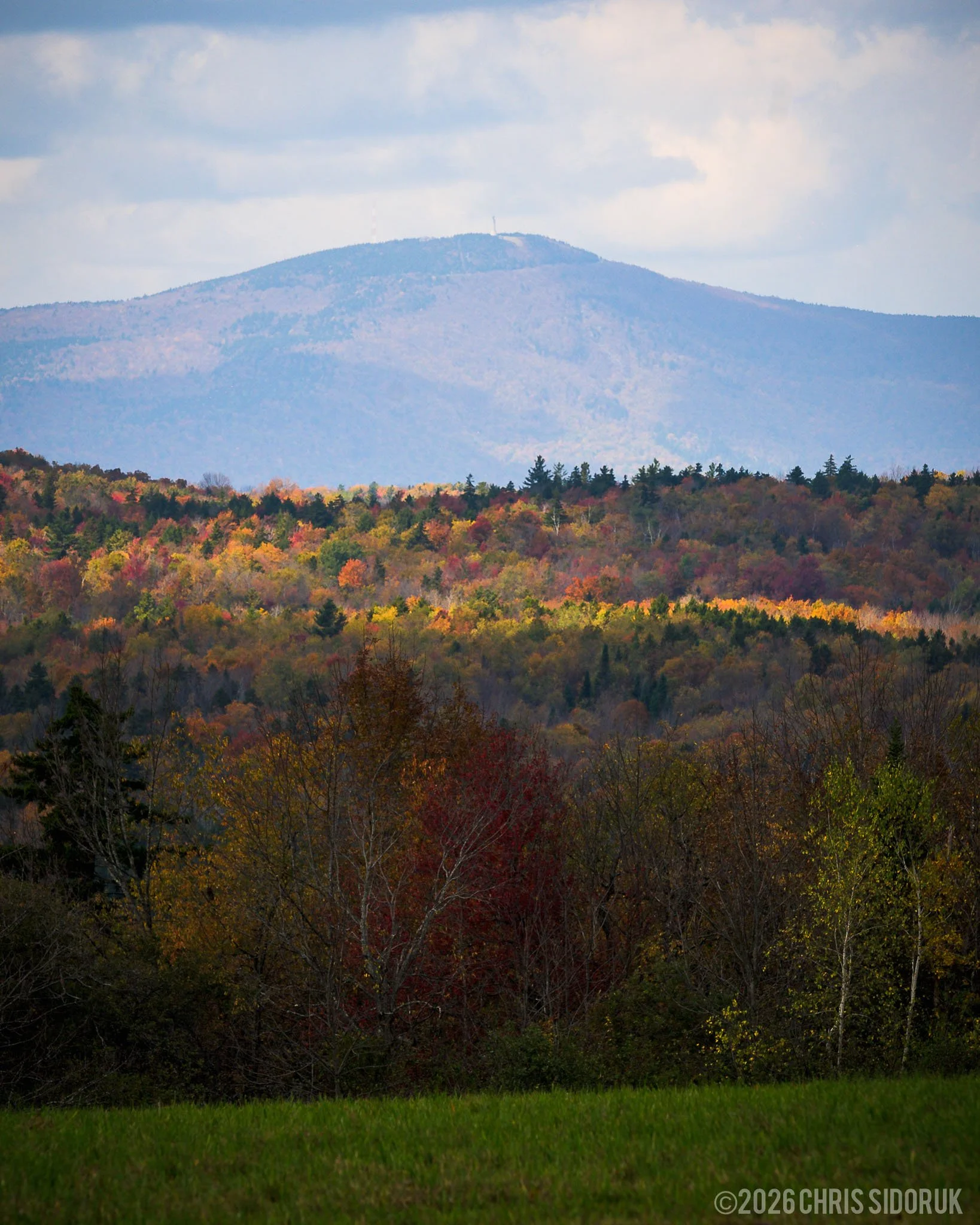 Mount Greylock rising above layered hills and grassy meadows in the Berkshires, photographed in early October 2024.