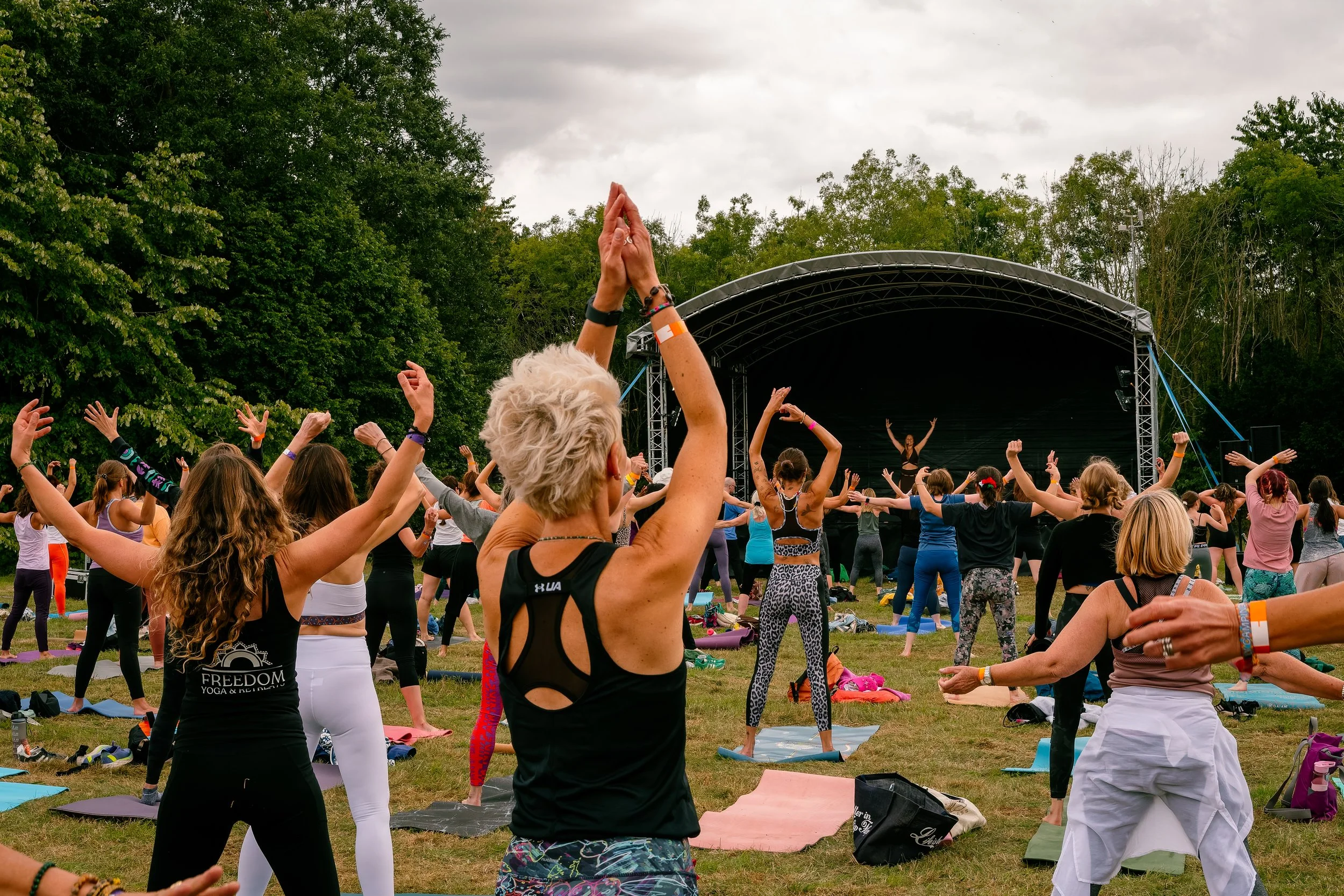 yogis in field doing yoga