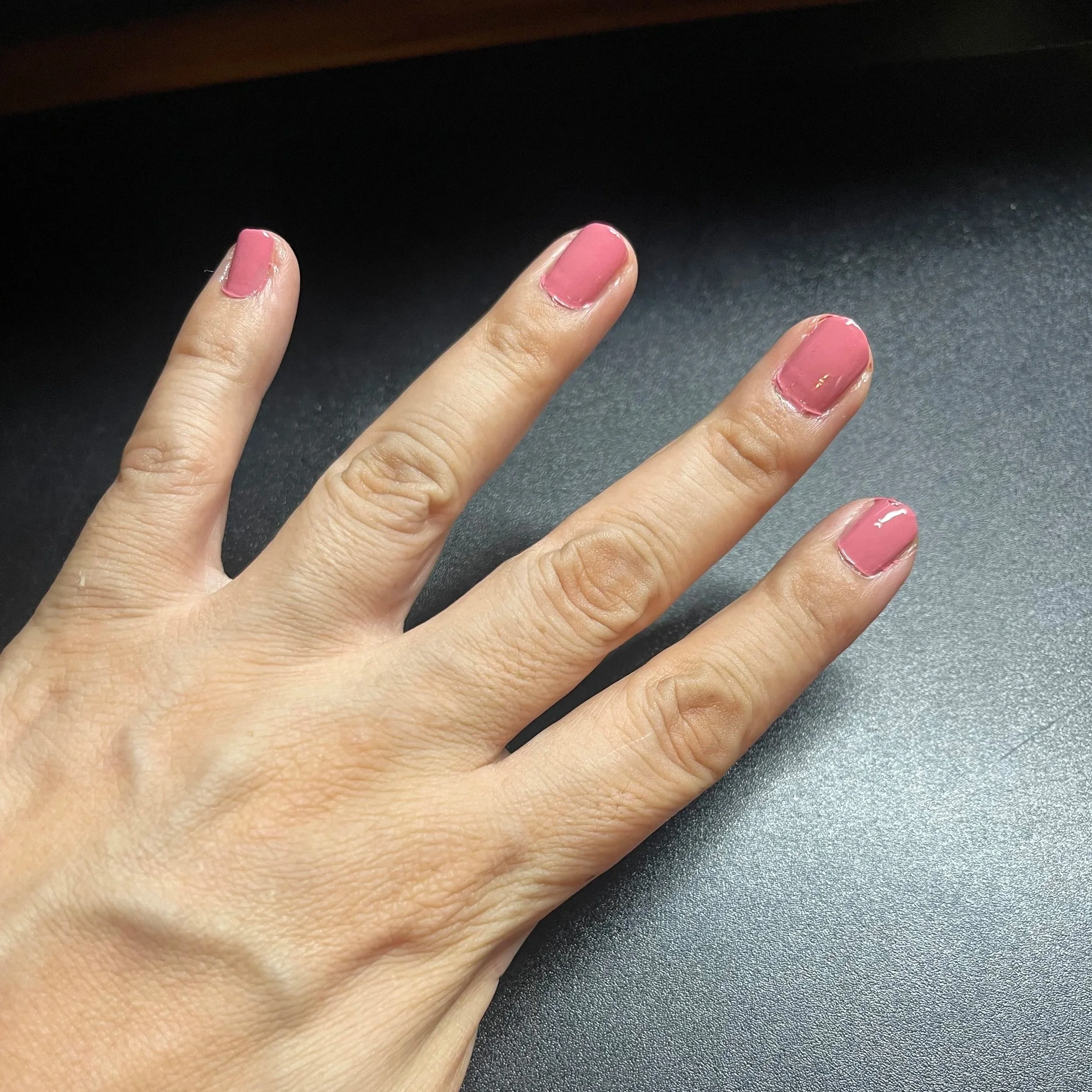 At home nail polish job , mauve left hand
