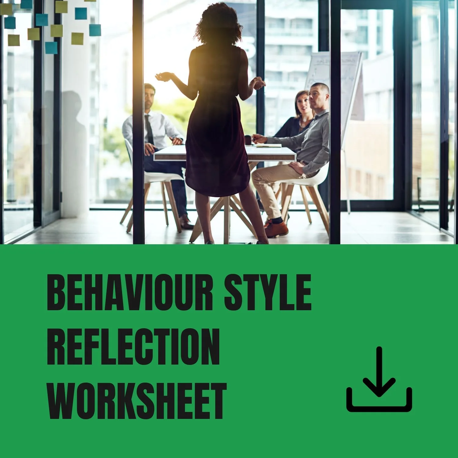 A woman standing and speaking to a group of three people seated at a conference table in a modern office with large windows.