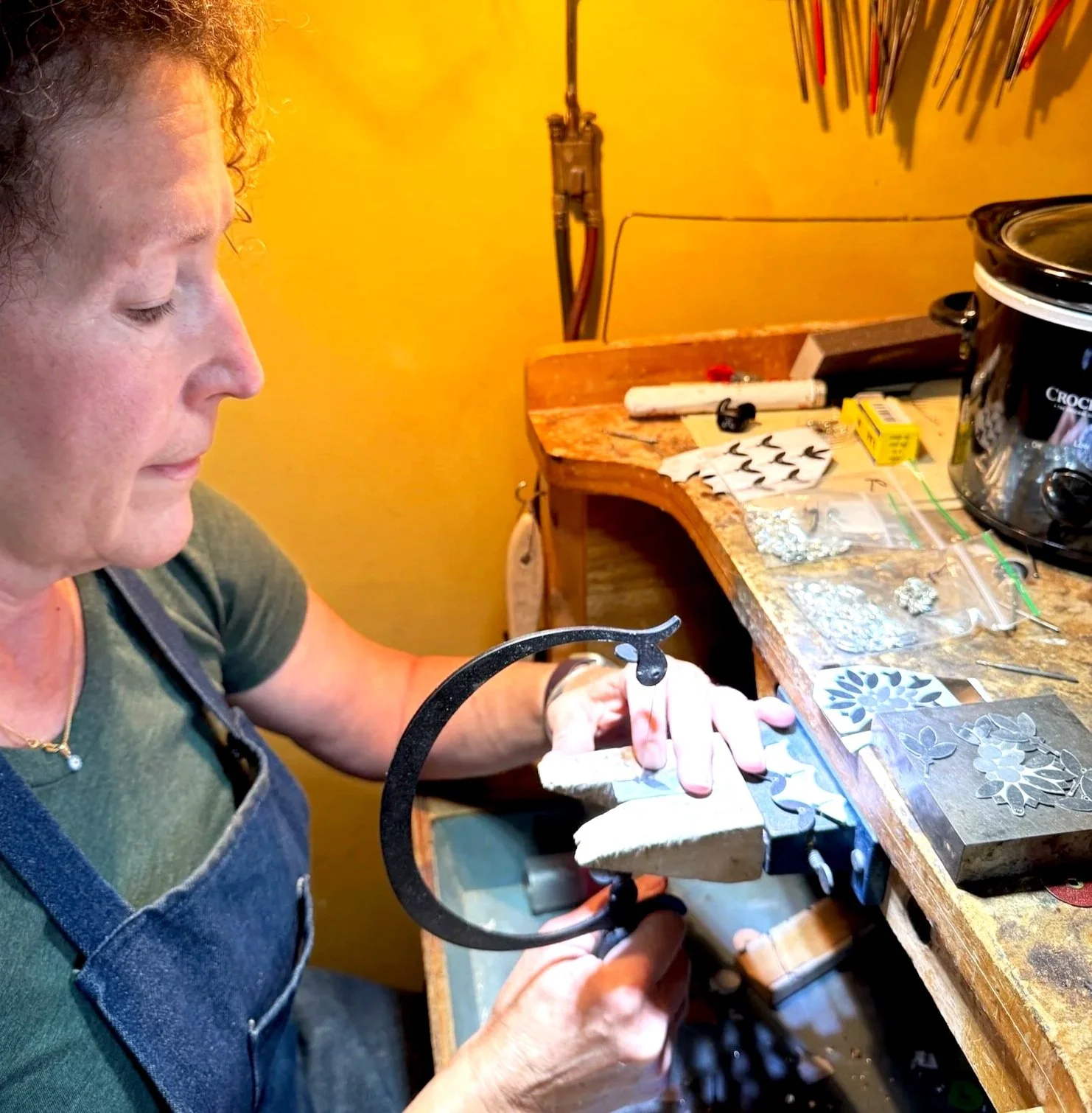 Kathleen working on the earrings