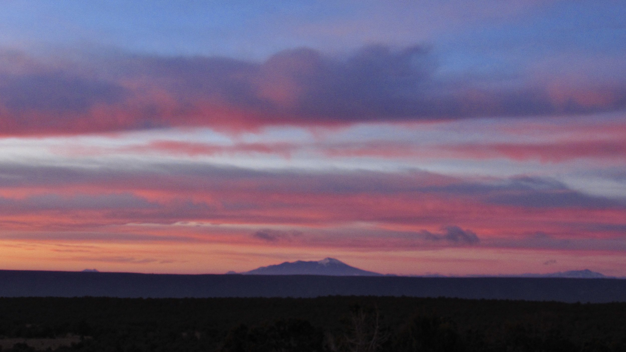 Sunrise on the San Francisco Peaks From the Grand Canyon of Arizona