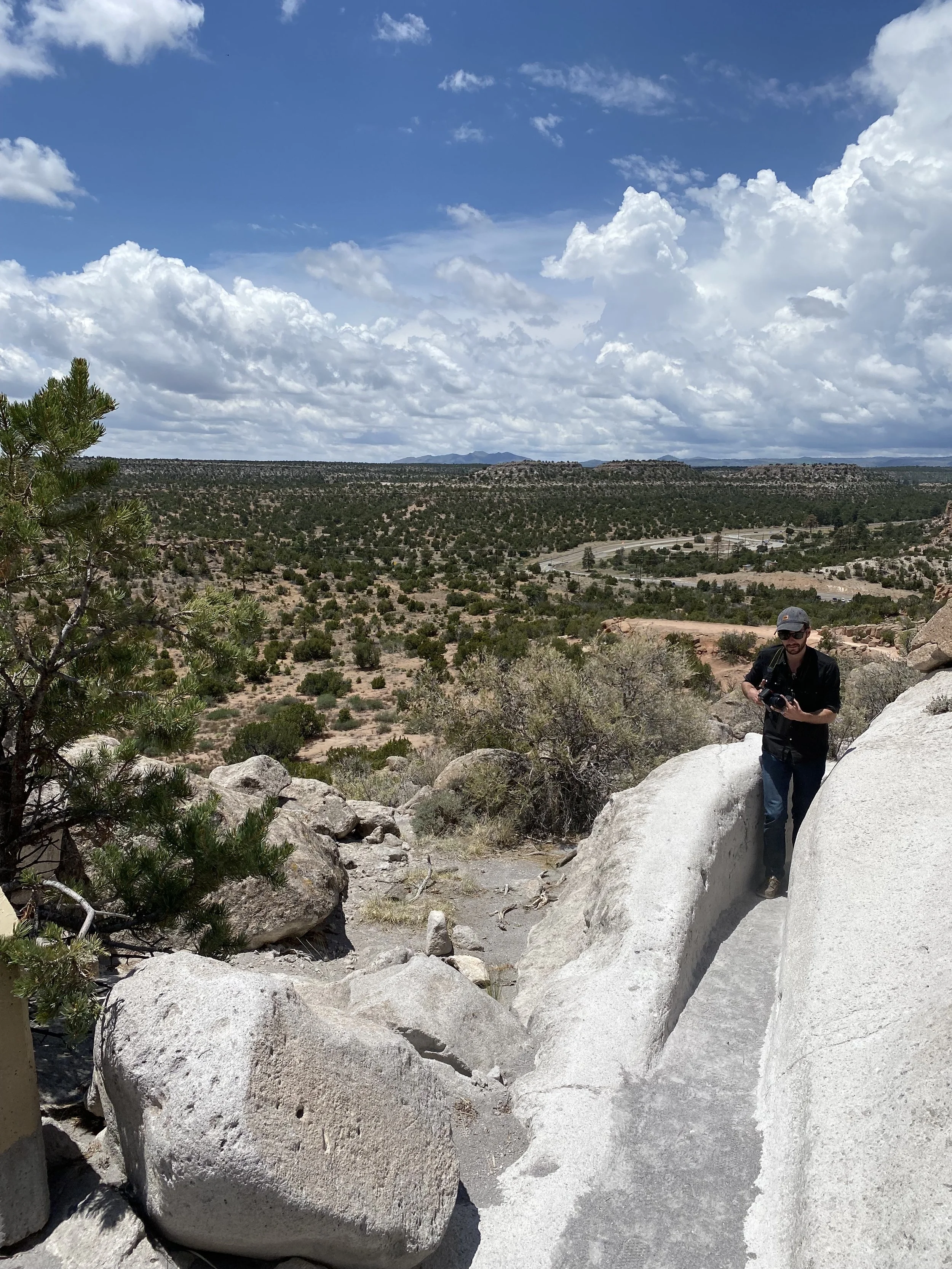 Thomas Wayne Riley hiking on Volcanic Tuff in Tsankawi Village, Bandelier National Monument, New Mexico