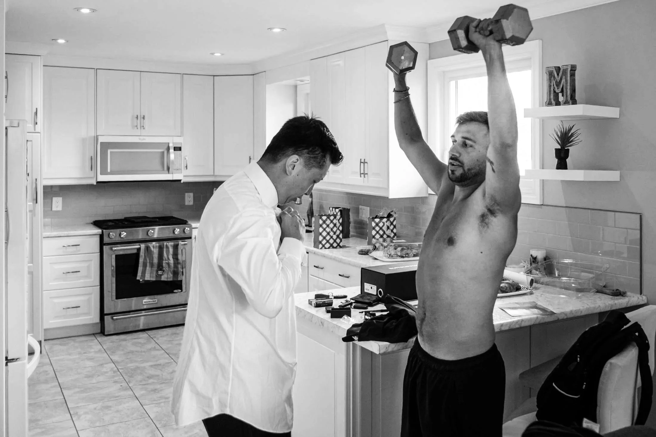 groom-and-best-man-lifting-weights-andreasphoto-1.jpg