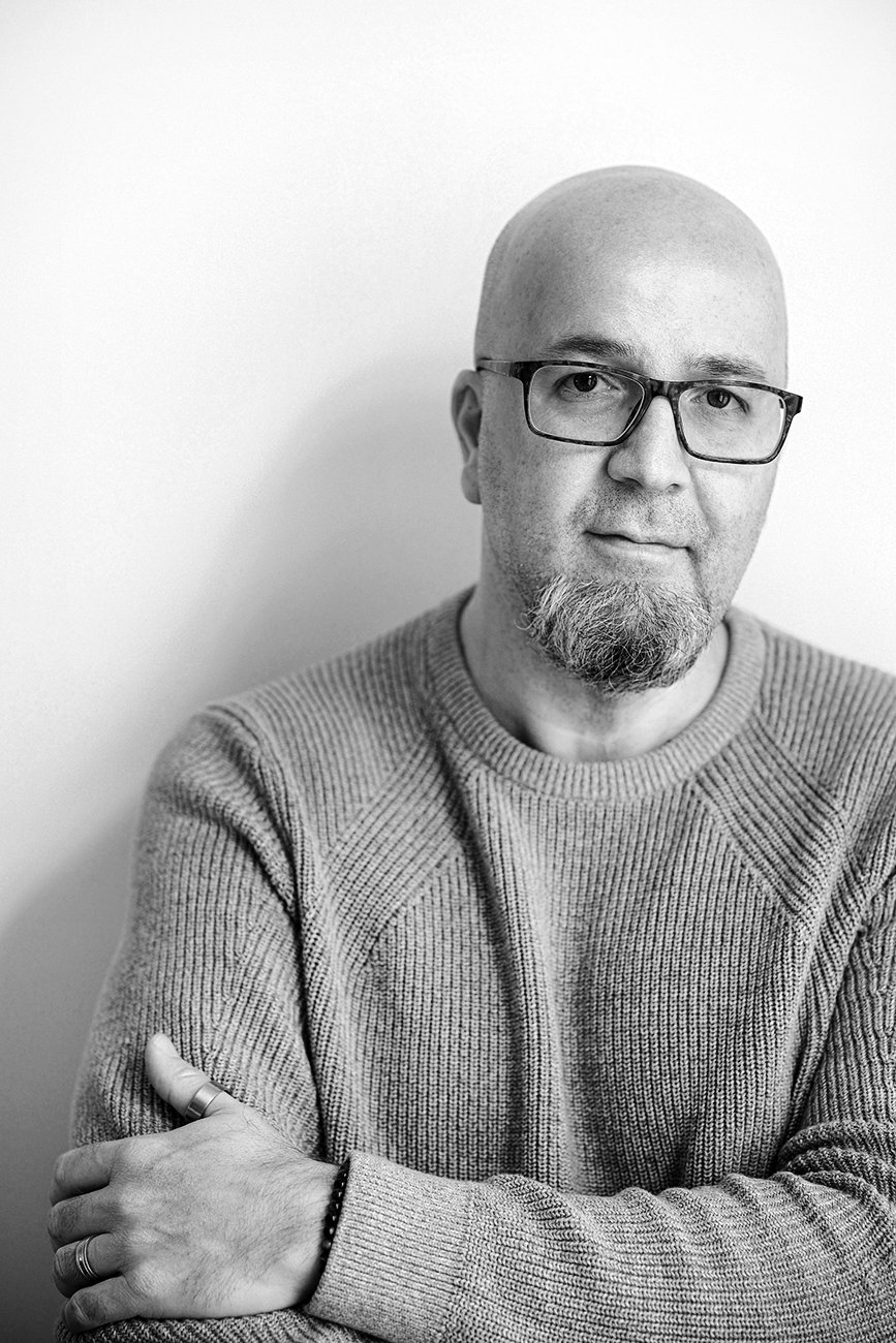 Portrait in black and white of Toronto Documentary Editorial Wedding and Event Photographer Andreas Avdoulos