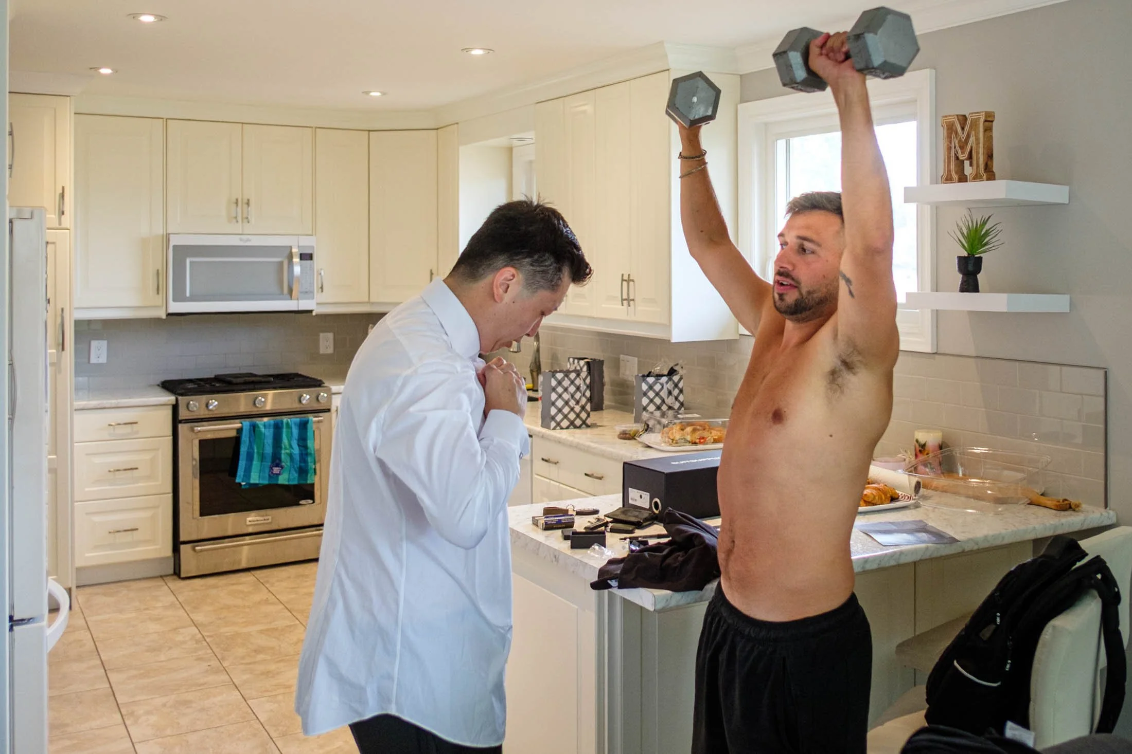 groom-and-best-man-lifting-weights-andreasphoto-1.jpg
