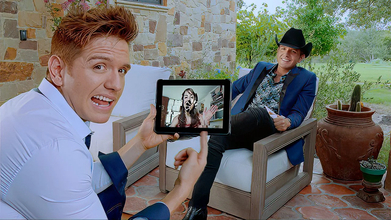 Two men in suits, one with a cowboy hat, relaxing outdoors on a patio with greenery and cactus. One man is sitting with legs crossed, smiling, while the other is sitting on a sofa, holding a tablet displaying a woman with a painted face.