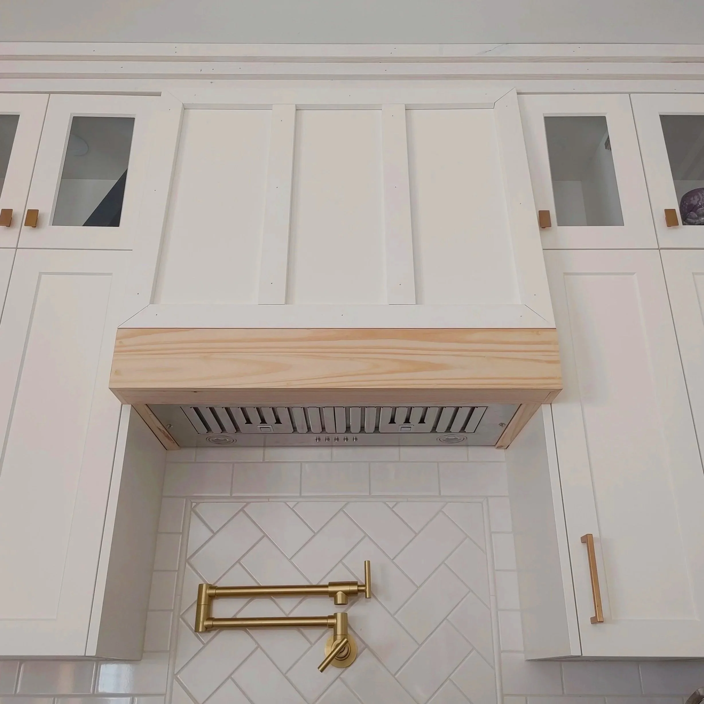 Traditional herringbone motif was used in the backsplash and flooring.