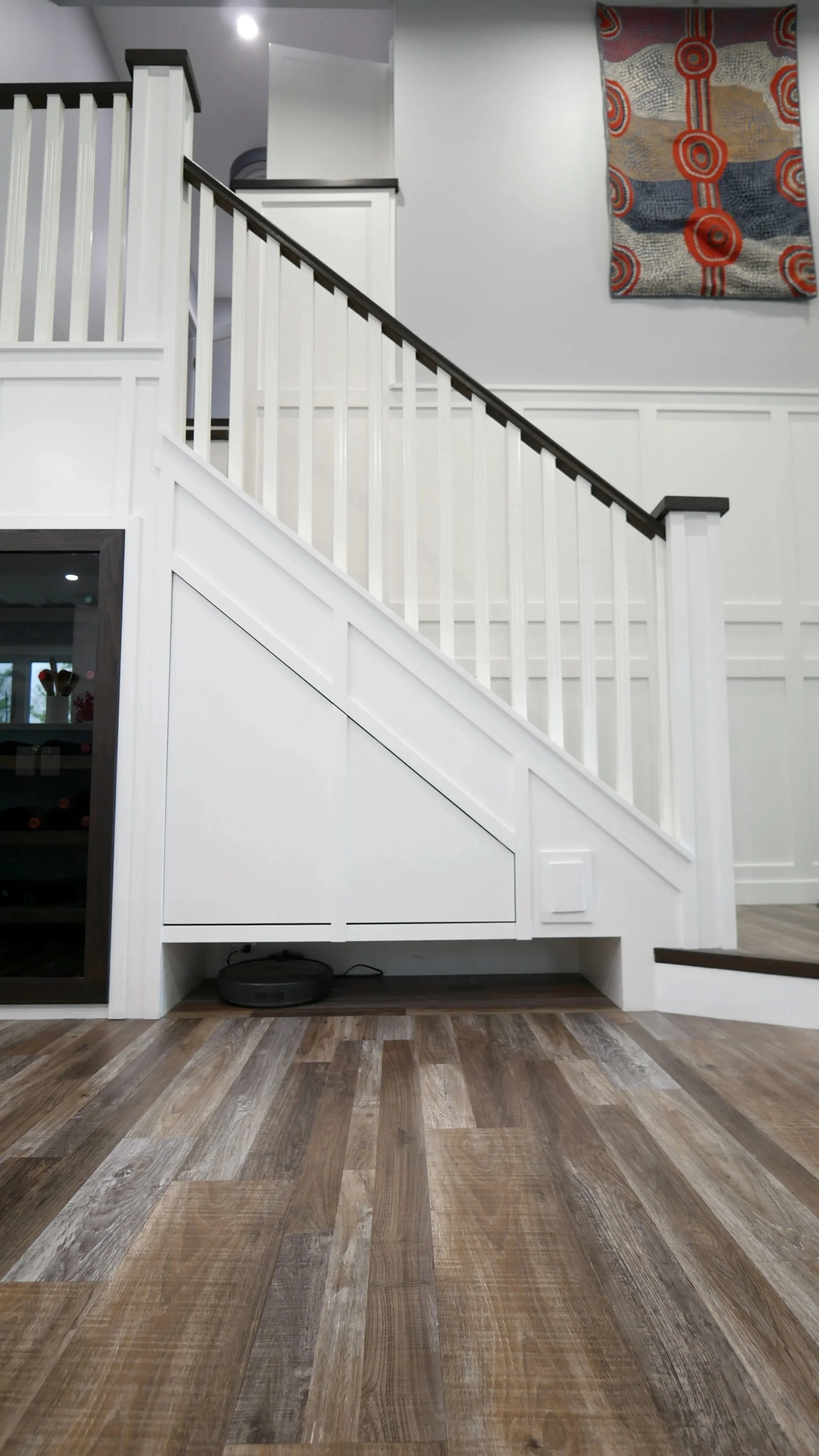 A charging area for the roomba is underneath a hidden door