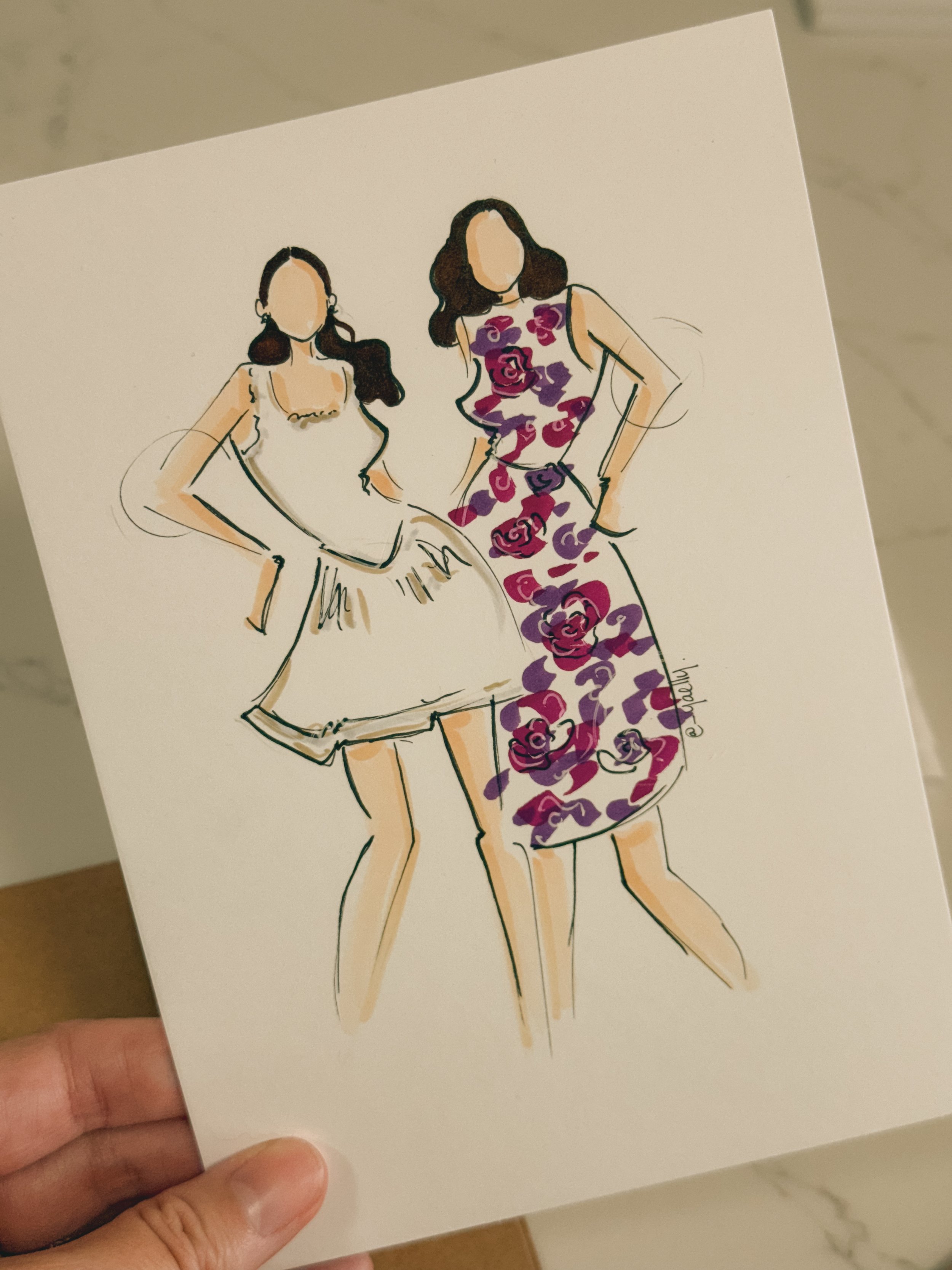 Hand-drawn illustration of two women posing in fashionable dresses, one in a white dress and the other in a purple floral dress, with faceless heads and long hair.