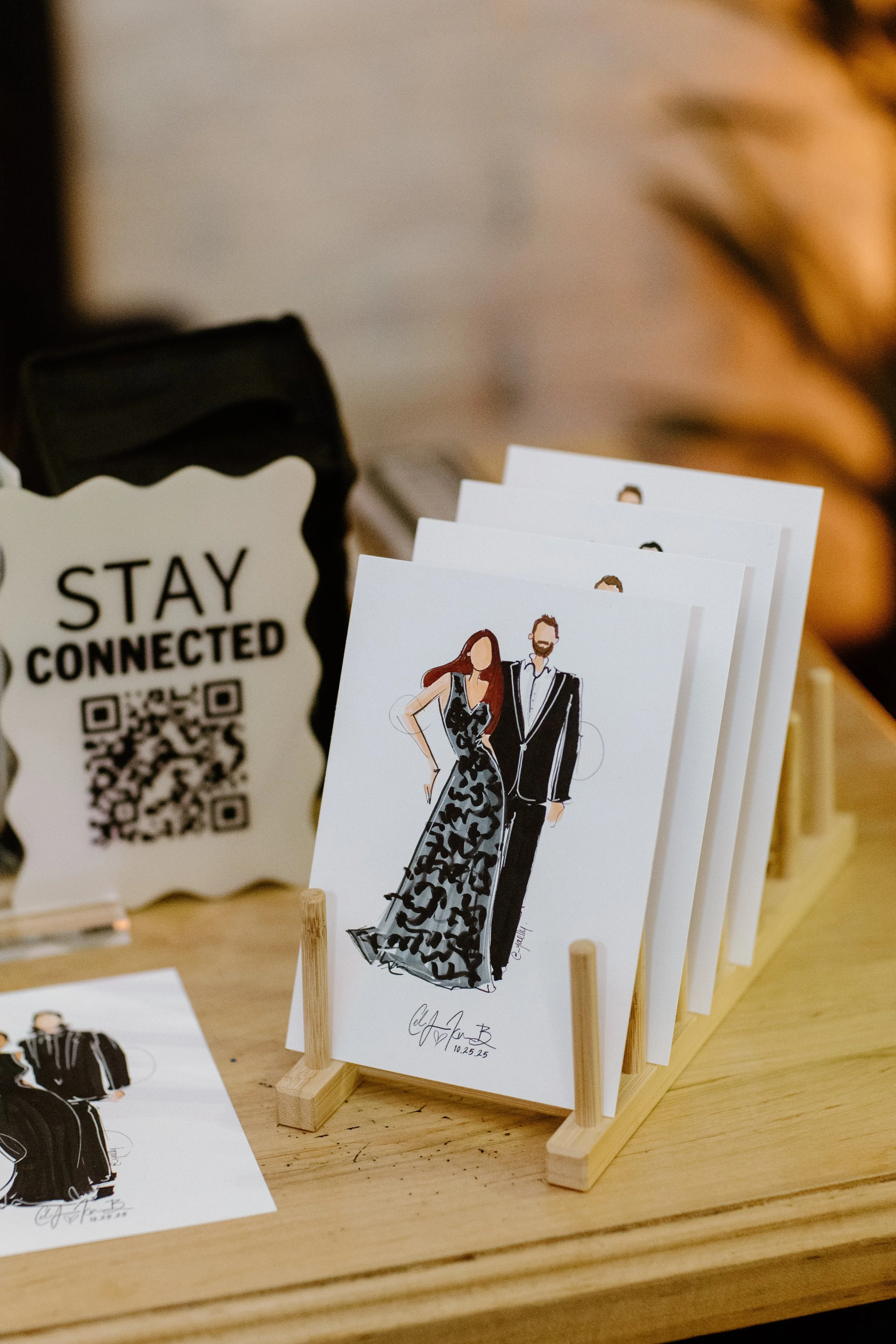An illustration of a man and woman in formal attire on display at an event, with a sign reading 'Stay Connected' and a QR code nearby.
