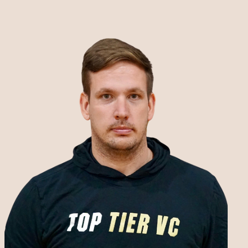A young man with short light brown hair and a slight beard wearing a black hoodie with "TOP TIER VC" written on it, against a plain white background.