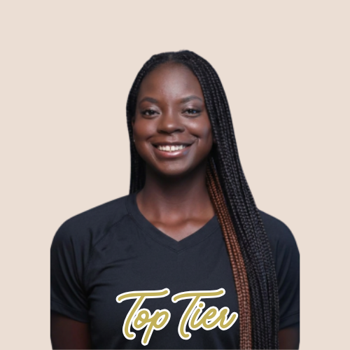 Portrait of a smiling woman with long braided hair wearing a blue sports jersey with the text 'HOFSTR' and the number 18, against a dark background.
