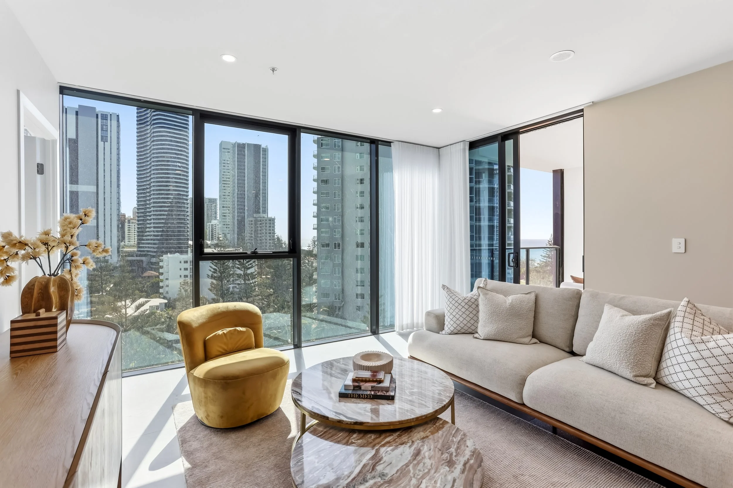 Large modern living room with yellow chair