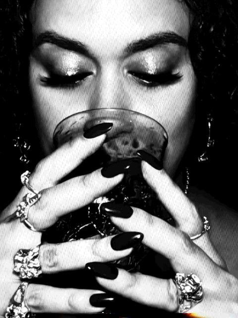Girl drinking from cup with silver rings on