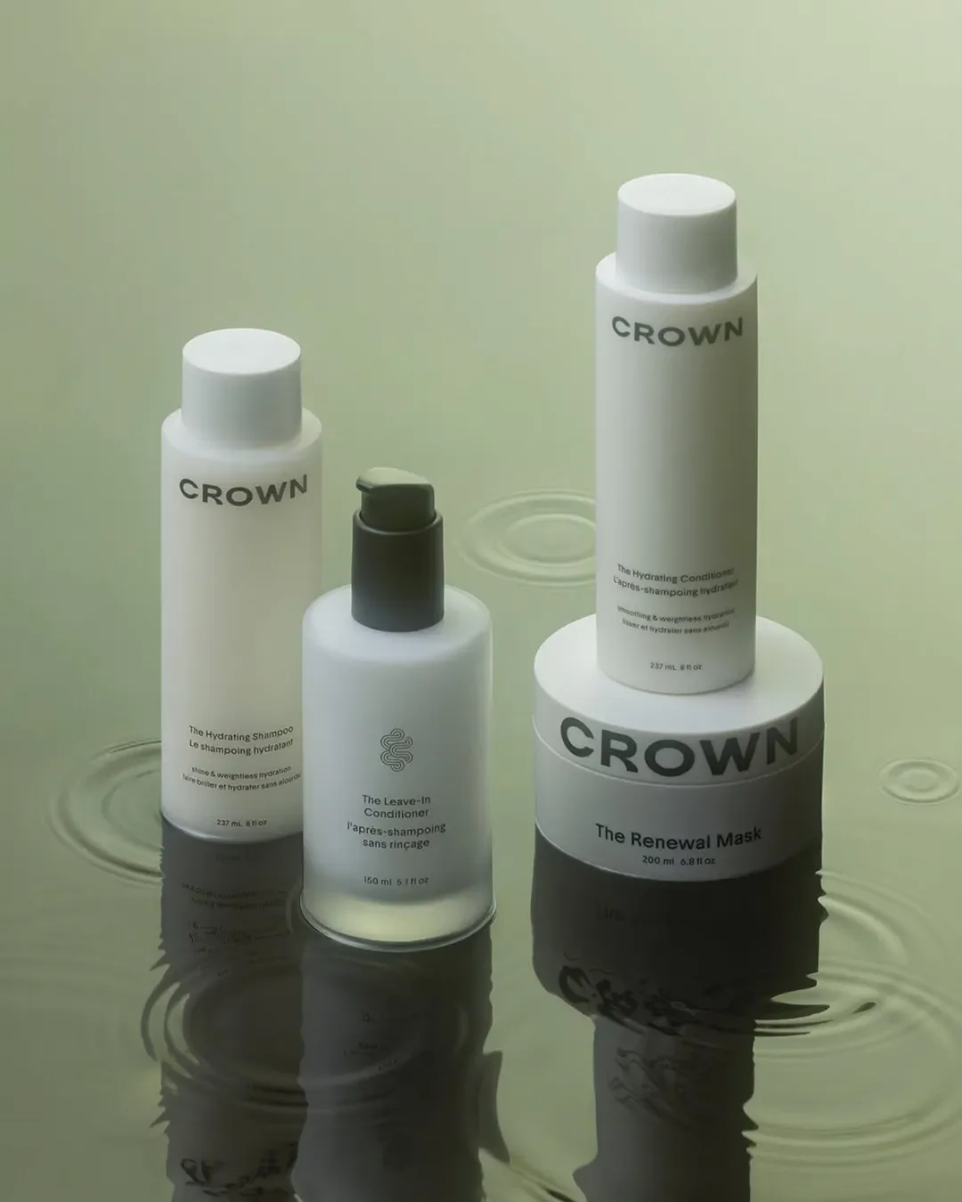 Crown affair product packaging, showing white minimalist hair product bottles