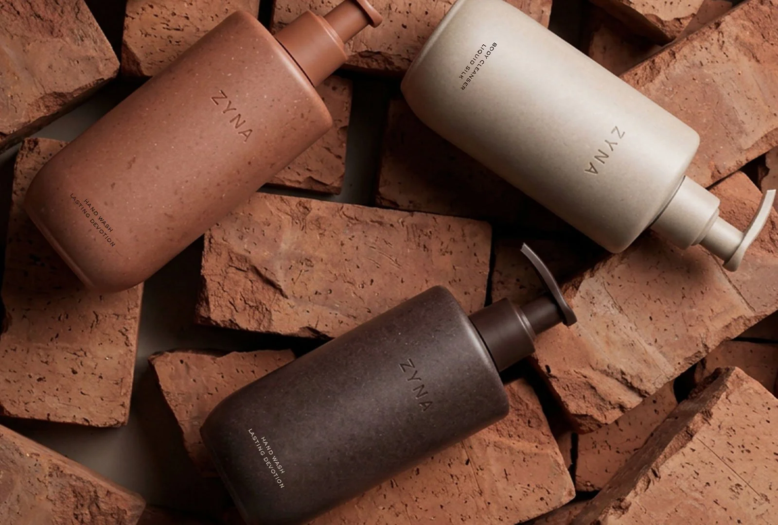 Toiletry packaging display on bricks with minimalist tones on Zyna