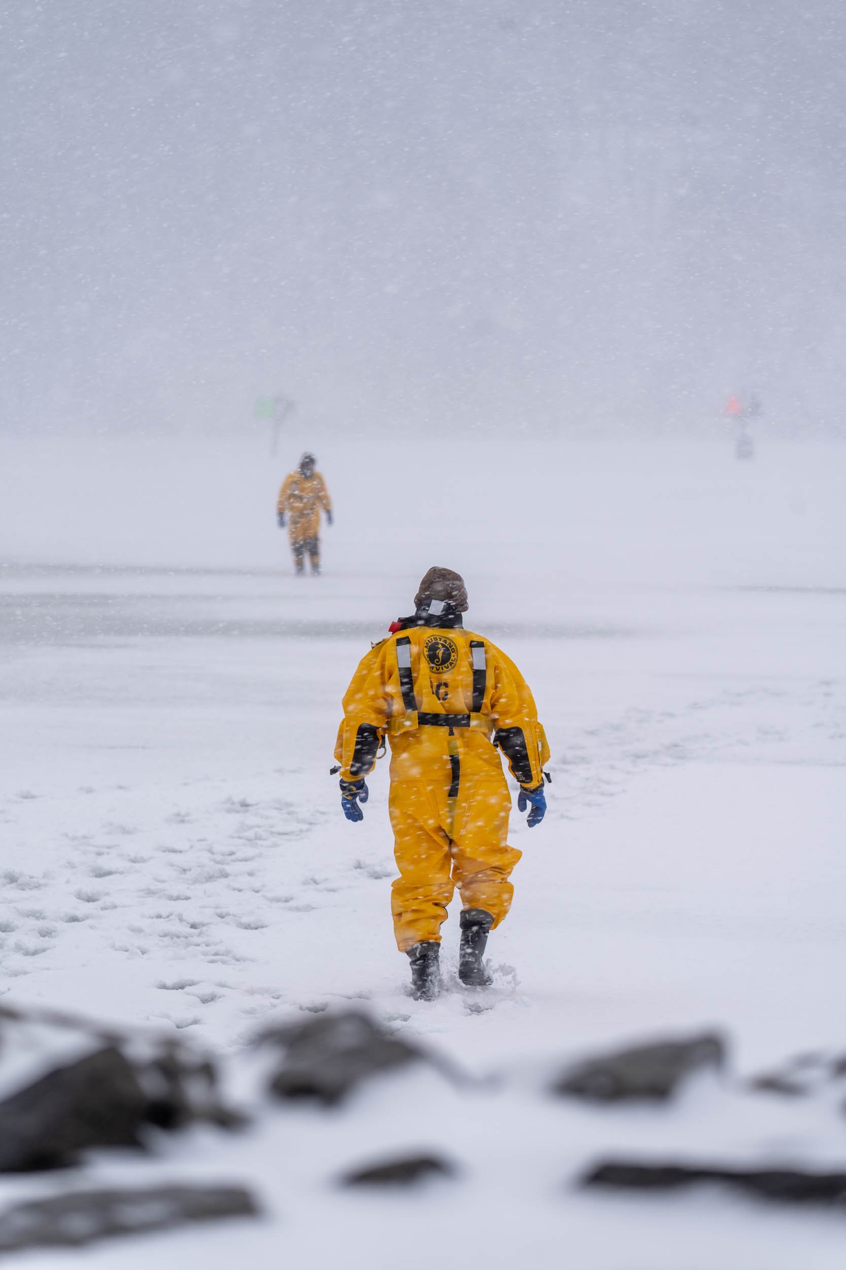 Shane Metcalfe, member of the Irondequoit Fire Station, test the strength of the ice in Irondequoit Bay, NY on February 18, 2022. New York firefighters train for ice rescues once a year and spend an hour out in the freezing temperatures.