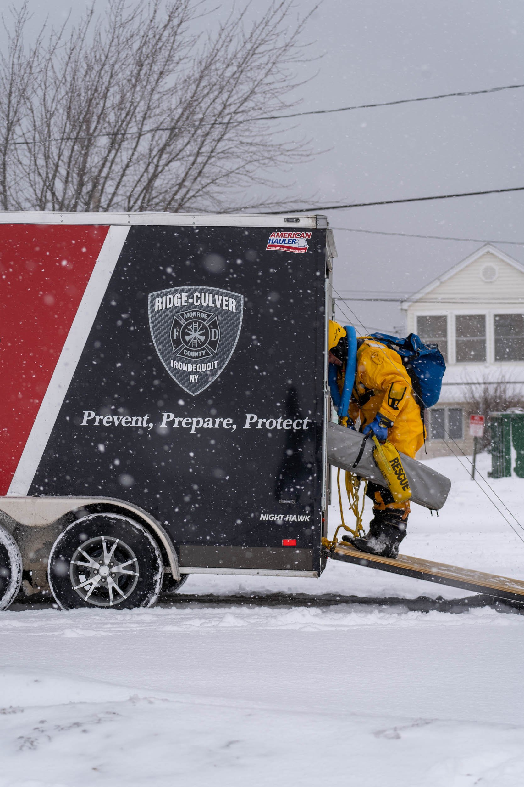Members of the Irondeqouit Fire Station train for ice rescues in Irondequoit Bay, NY on February 18, 2022. New York firefighters train for ice rescues once a year and spend an hour out in the freezing temperatures.