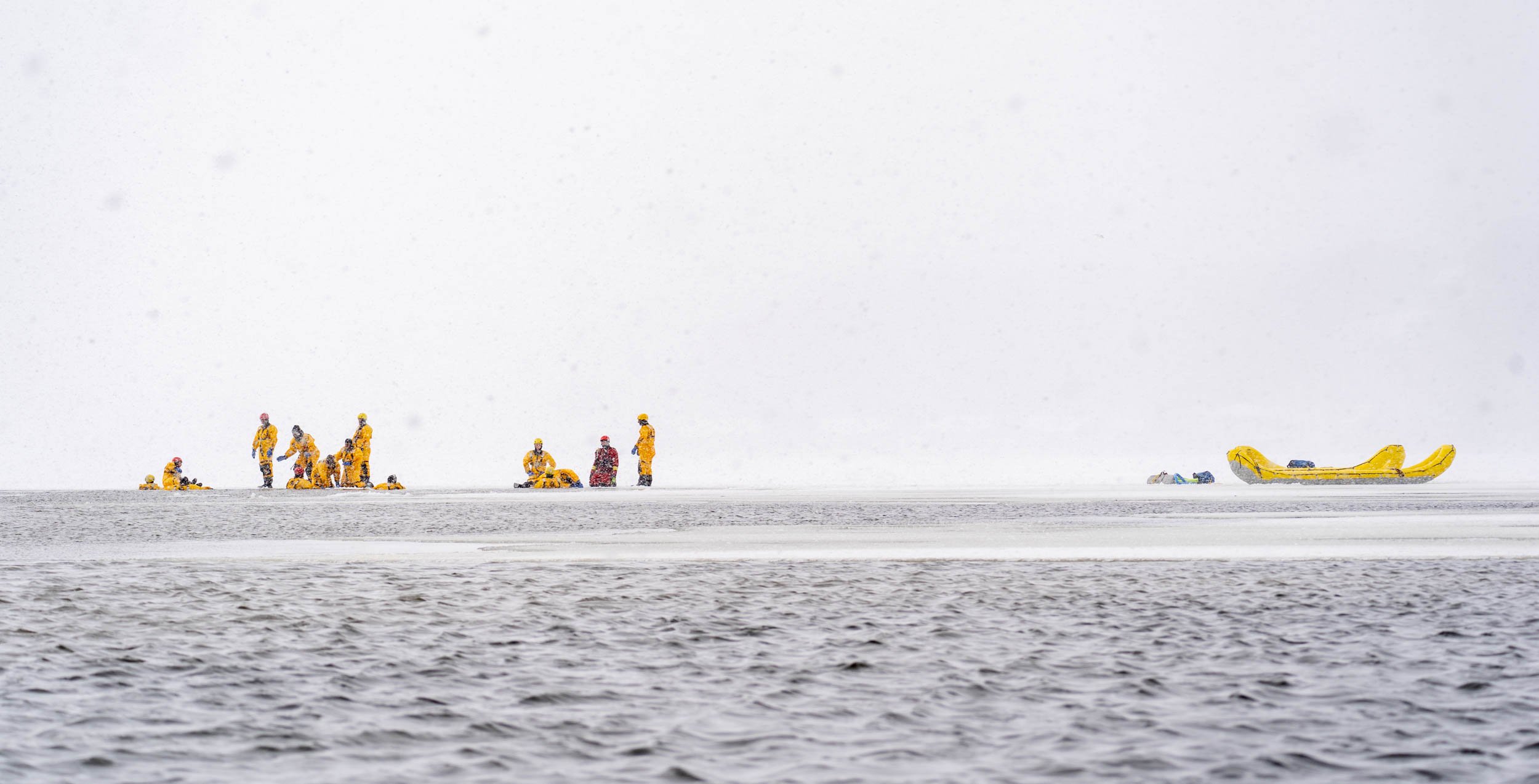 Members of the Irondeqouit Fire Station train for ice rescues in Irondequoit Bay, NY on January 18, 2022. New York firefighters train for ice rescues once a year and spend an hour out in the freezing temperatures.