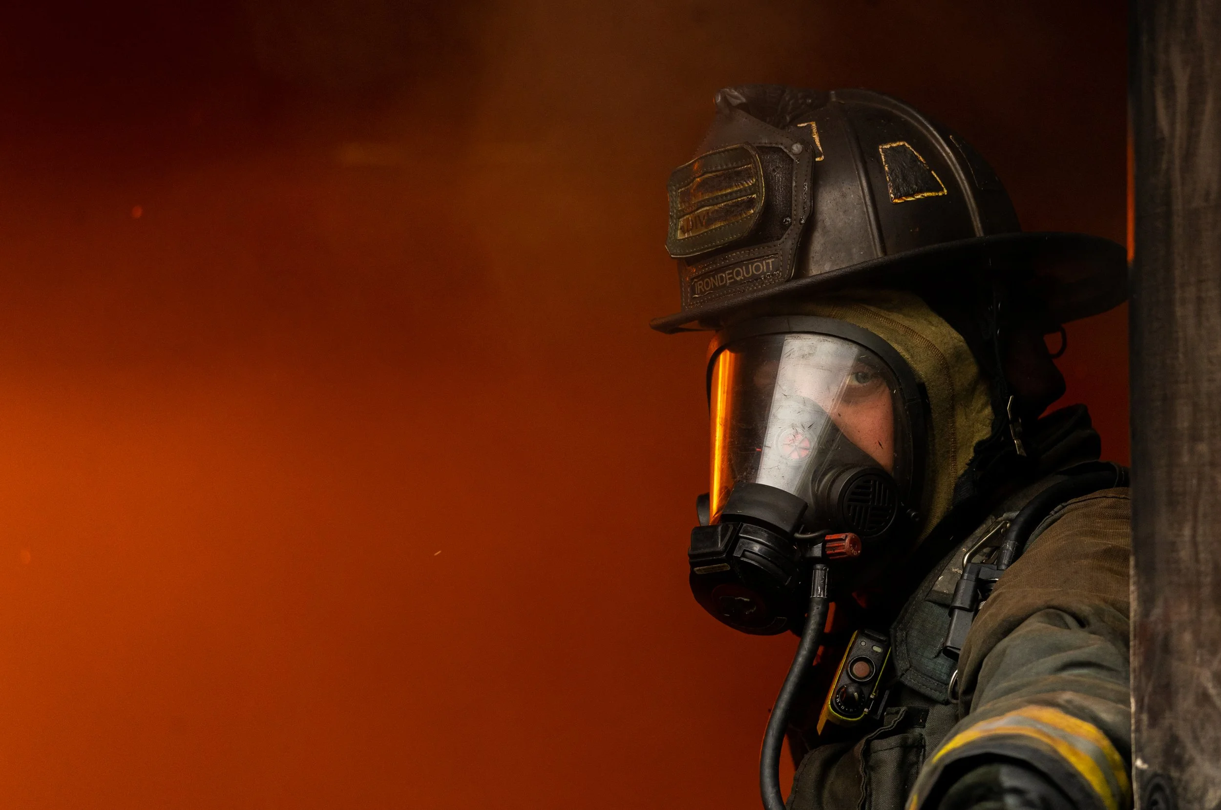  Lt. Josh Mastin helps conduct live burn training with the Irondequoit Fire Department at the Fairport Fire Training Center in Fairport, N.Y. on Oct. 13, 2022. The fire department conducts the live fire training annually and requires that all firefig