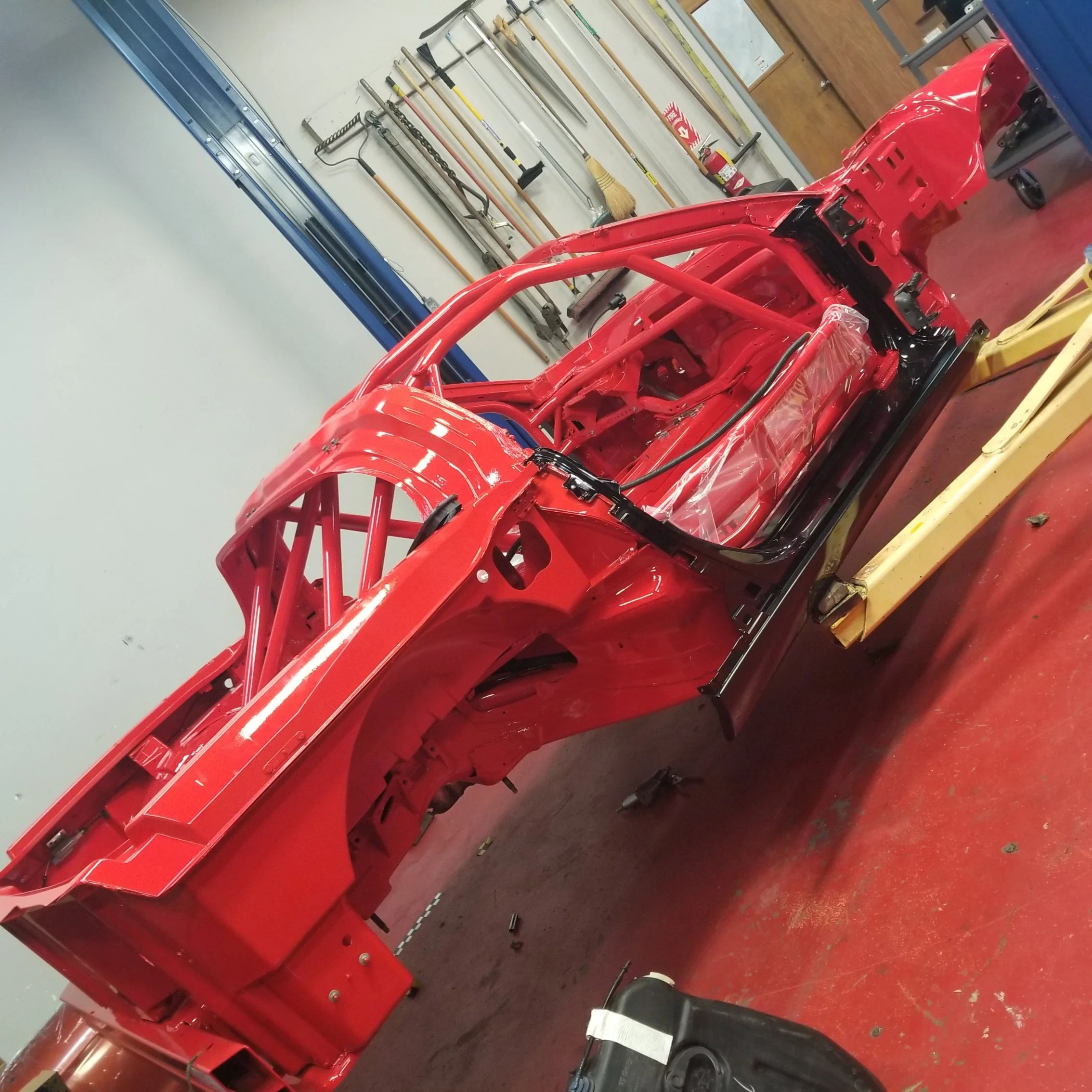 side view of a red corvette chassis