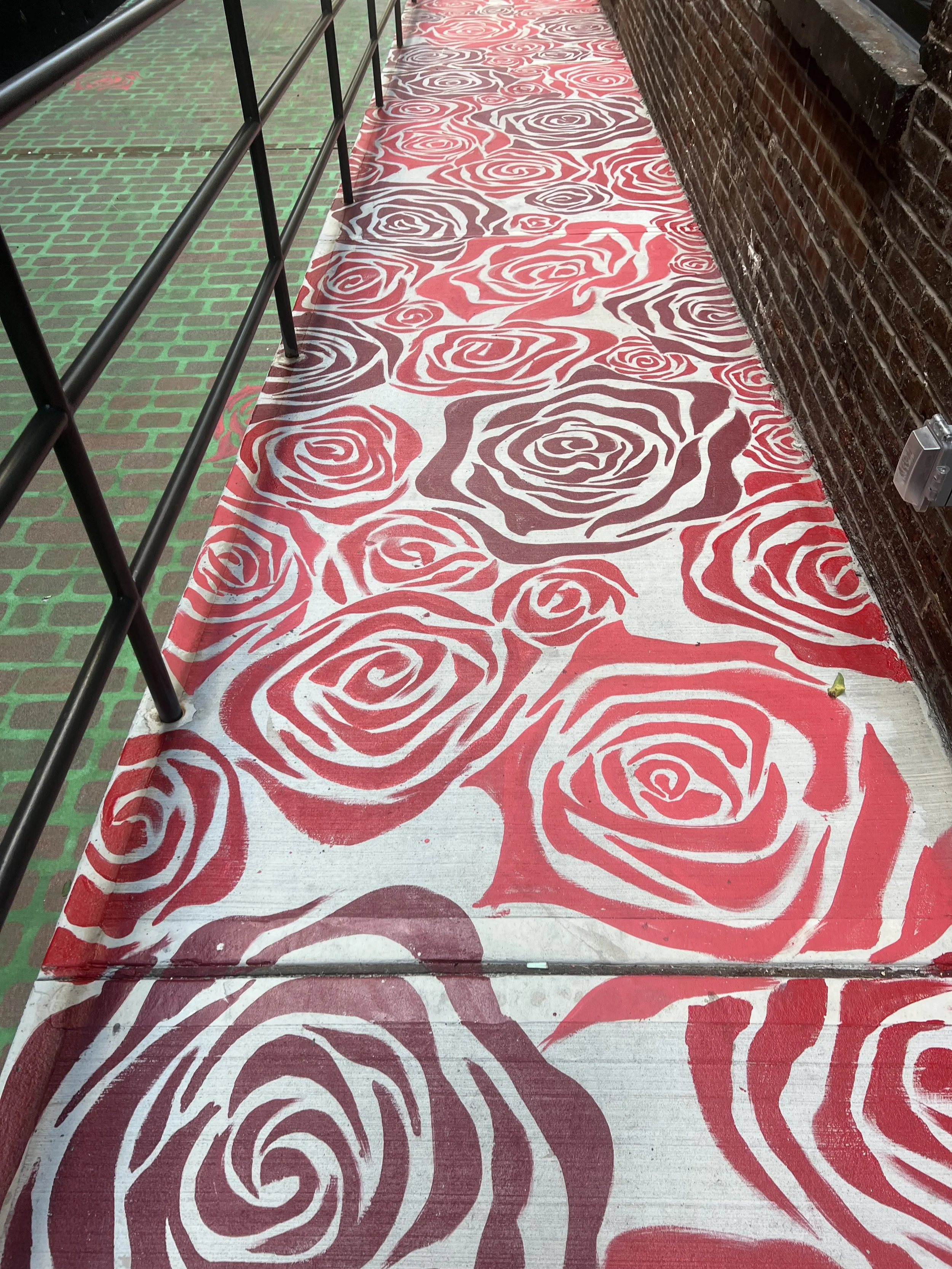 This mural on a ramp is over 90 ft long, honors the walk of every heritage who enter.