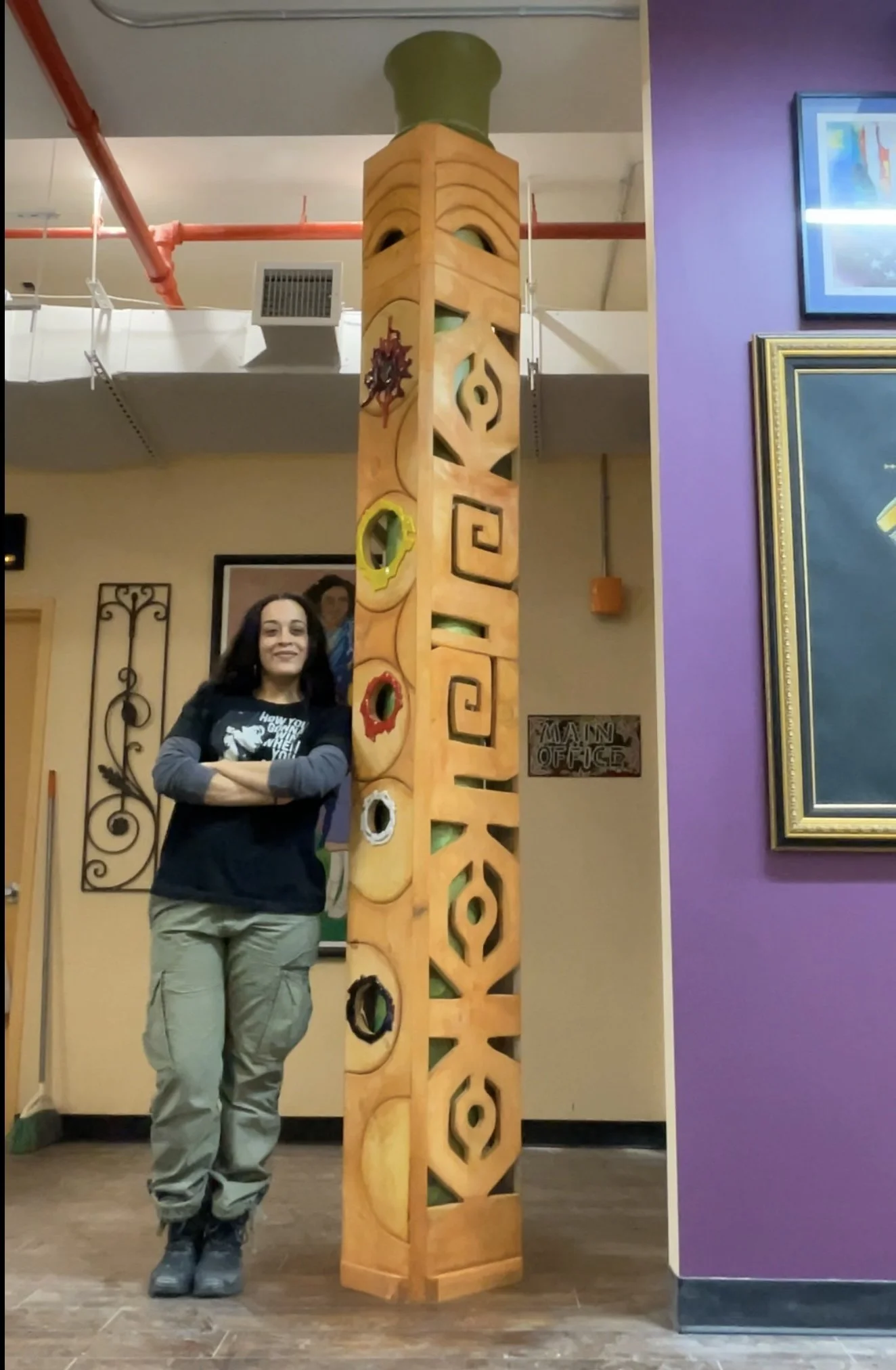 Totem Sculpture titled, '4 Realms' celebrating the journey of migration at the entryway.